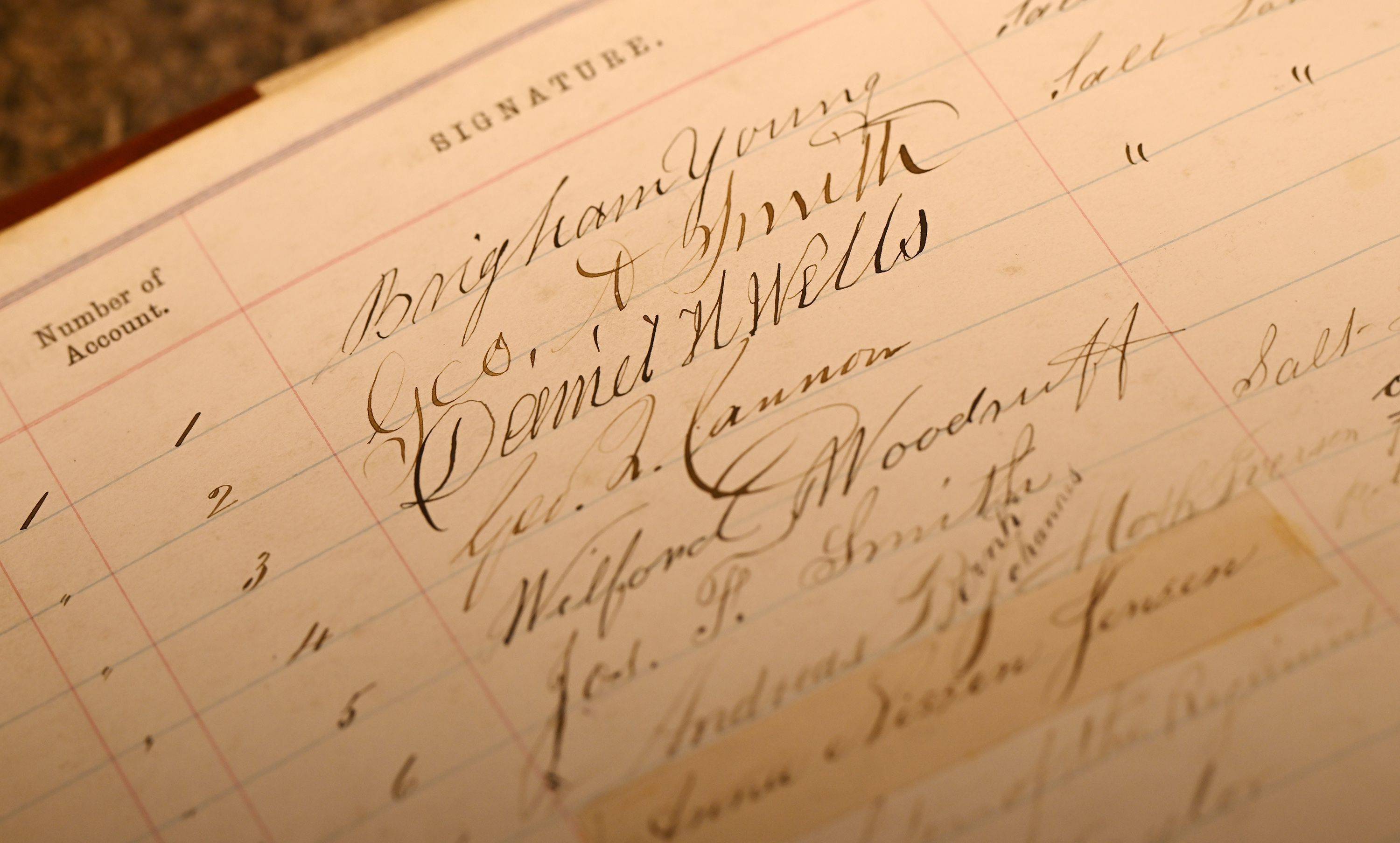 Signatures of Brigham Young and other leaders of The Church of Jesus Christ of Latter-day Saints in a bank ledger at the Zions Bank corporate offices in Salt Lake City on Sept. 20.