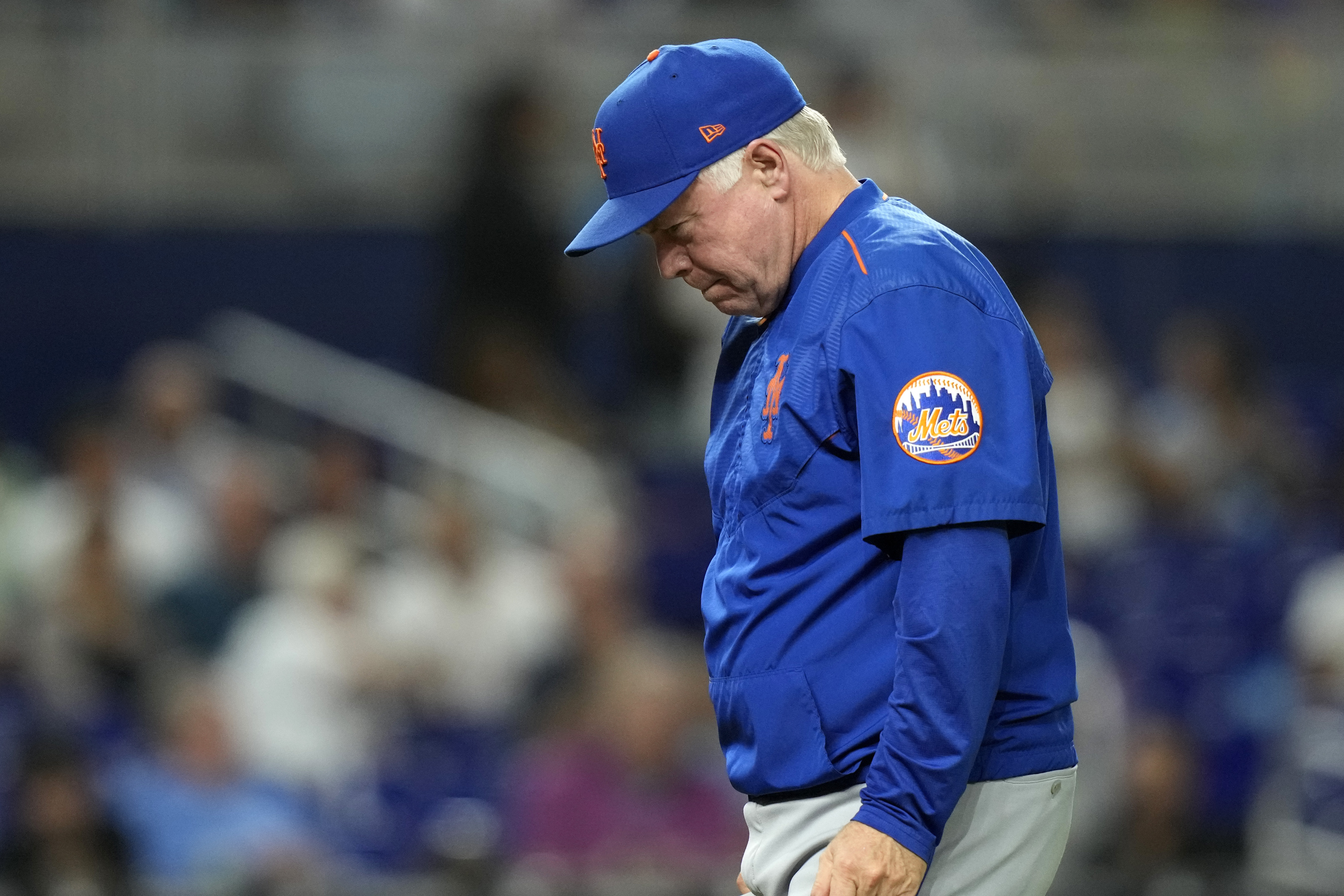 New York Mets manager Buck Showalter walks from the mound after a pitching change during the eighth inning of a baseball game against the Miami Marlins, Wednesday, Sept. 20, 2023, in Miami.