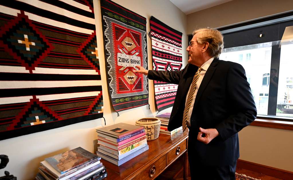 Zions Bank President and CEO Scott Anderson shows a gift that he received from members of the Navajo Nation that he has on display in his office in Salt Lake City on Sept. 20.