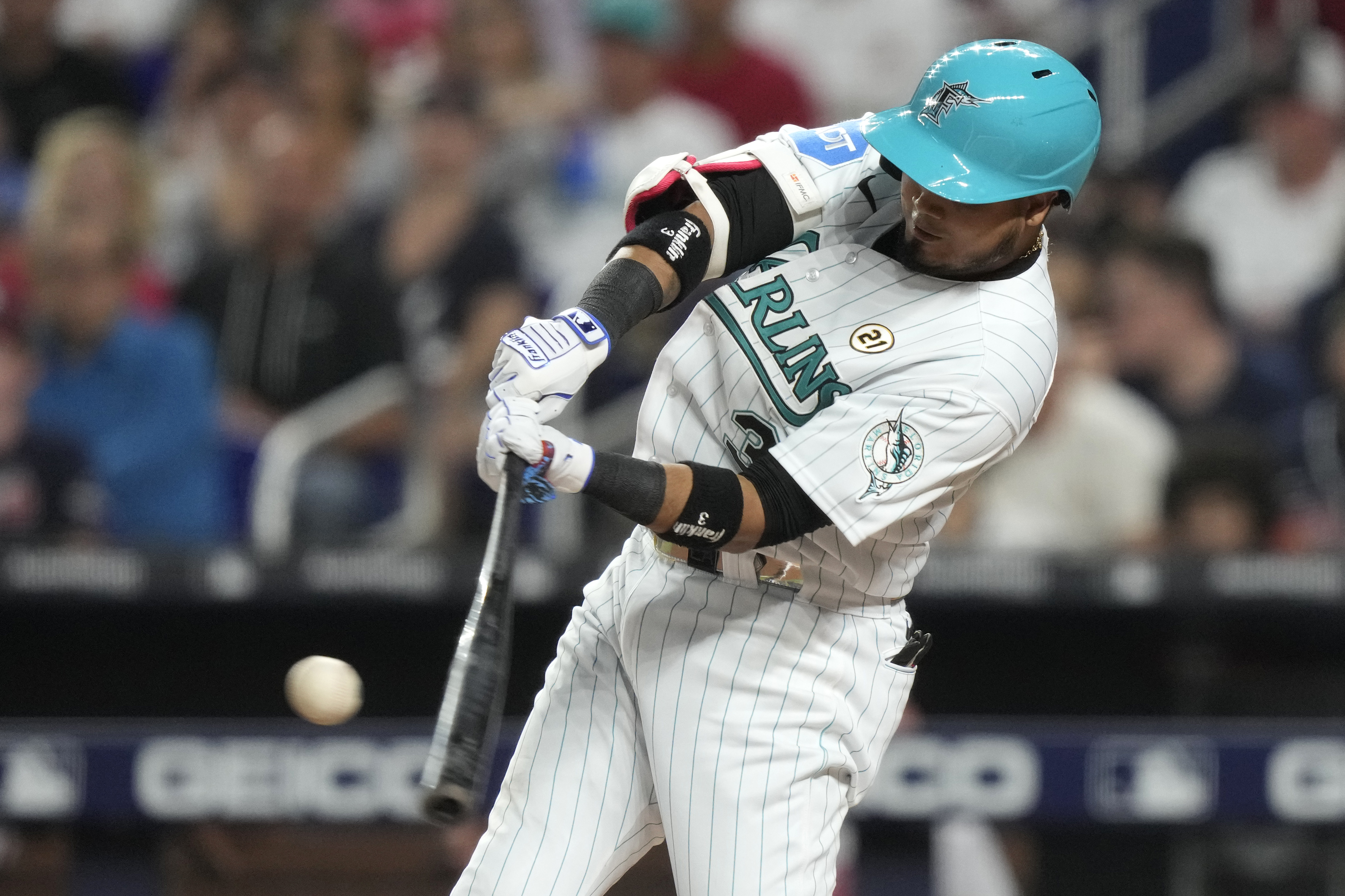 Miami Marlins' Luis Arraez hits a solo home run during the first inning of a baseball game against the Atlanta Braves, Friday, Sept. 15, 2023, in Miami.