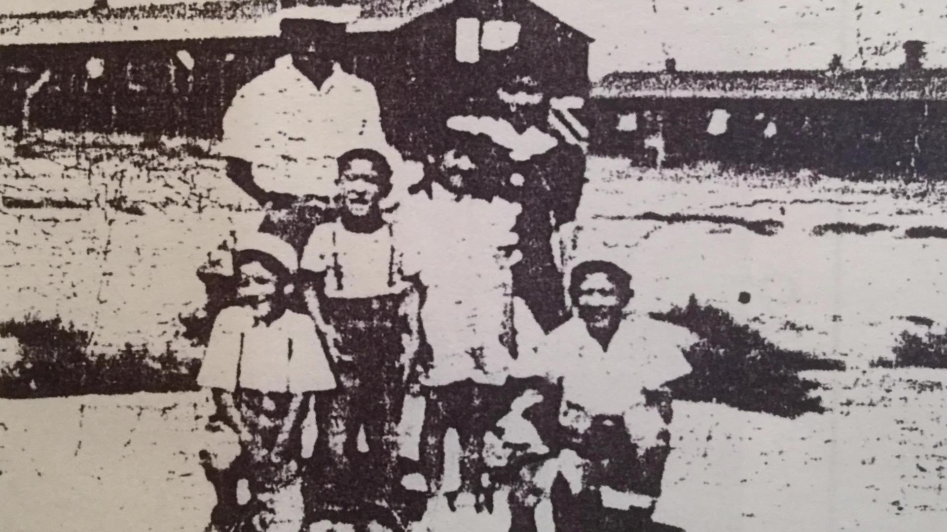 A photo of the Uyematsu family in an internment camp.