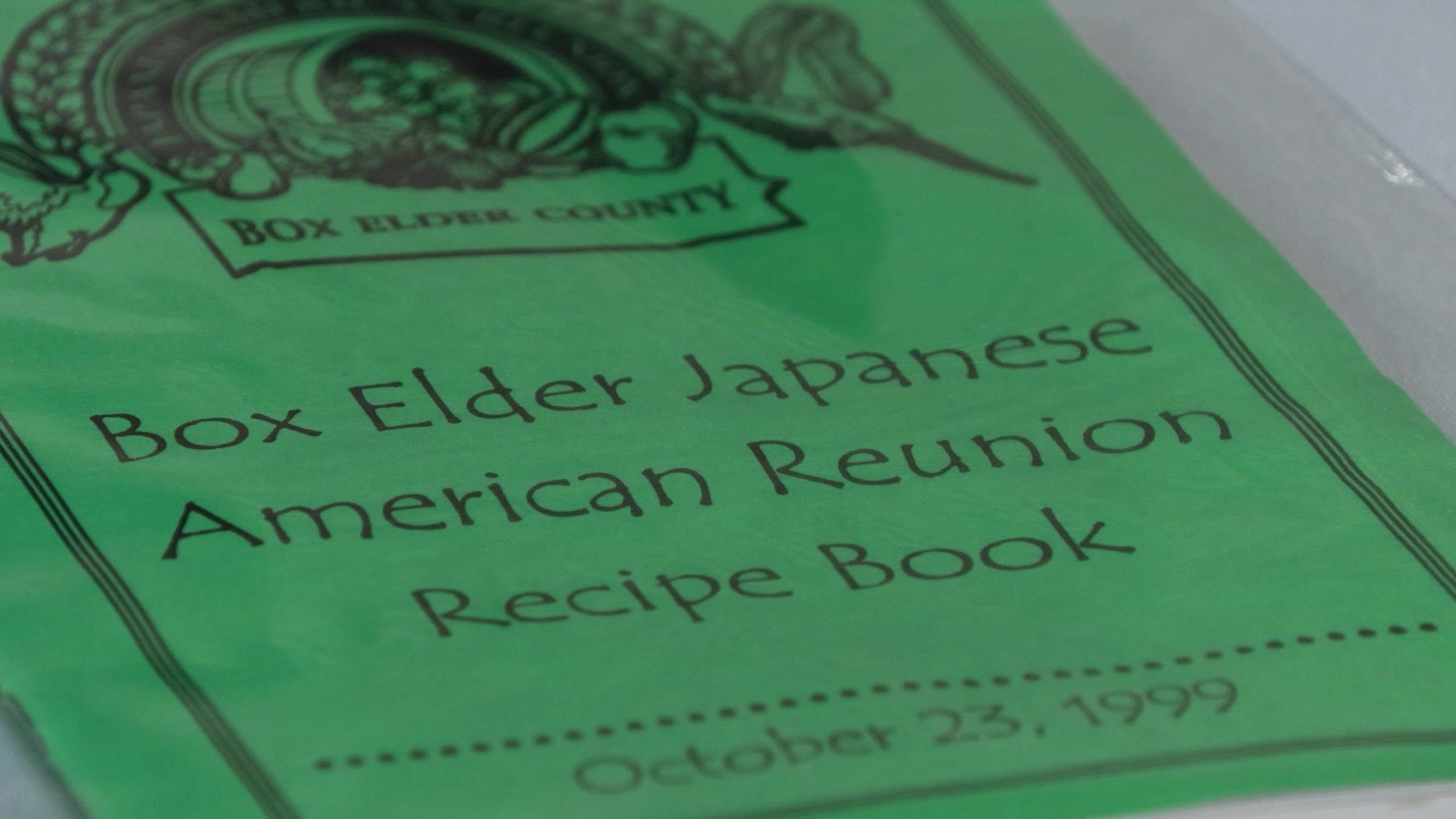 A photo of a “Box Elder Japanese American Reunion Recipe book,” dated Oct. 23, 1999, is seen in this undated photo.