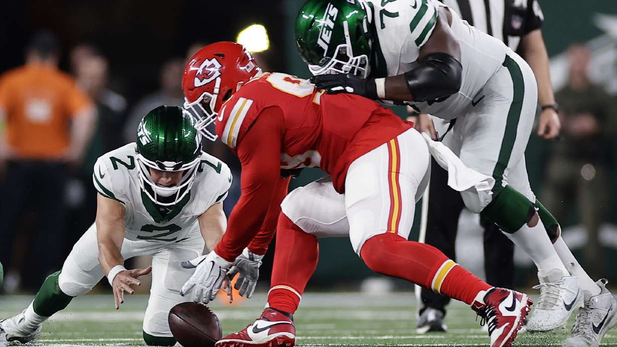 New York Jets quarterback Zach Wilson (2) fumbles the ball to turn the ball over to the Kansas City Chiefs during the fourth quarter of an NFL football game, Sunday, Oct. 1, 2023, in East Rutherford, N.J.