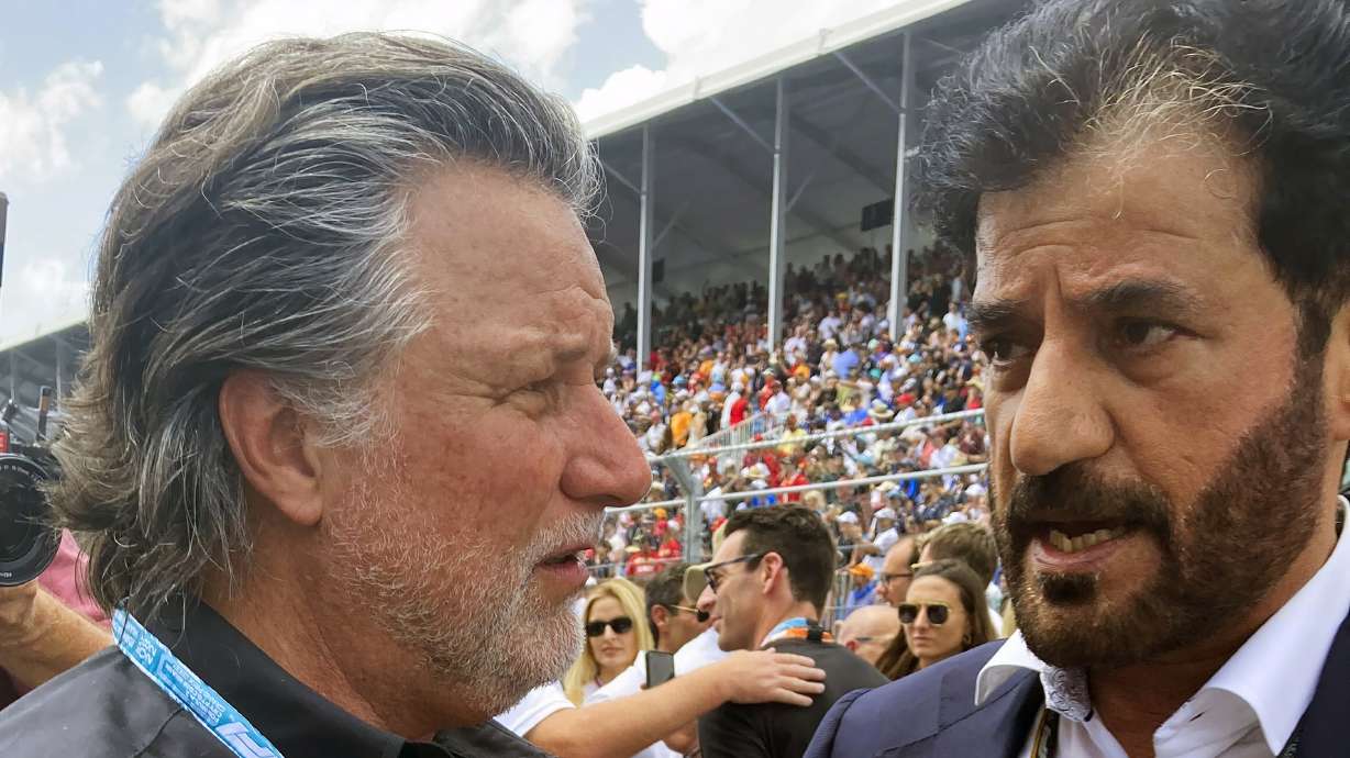 FILE - Michael Andretti, left, talks with FIA President Mohammed bin Sulayem before the Formula One Miami Grand Prix auto race at Miami International Autodrome, Sunday, May 8, 2022, in Miami Gardens, Fla. The FIA on Monday, Oct. 2, 2023, said Michael Andretti meets all required criteria to field a future Formula One team. Monday's announcement was a first — but important — step in Andretti's three-year quest to return one of racing's most storied names to the pinnacle of motorsports.