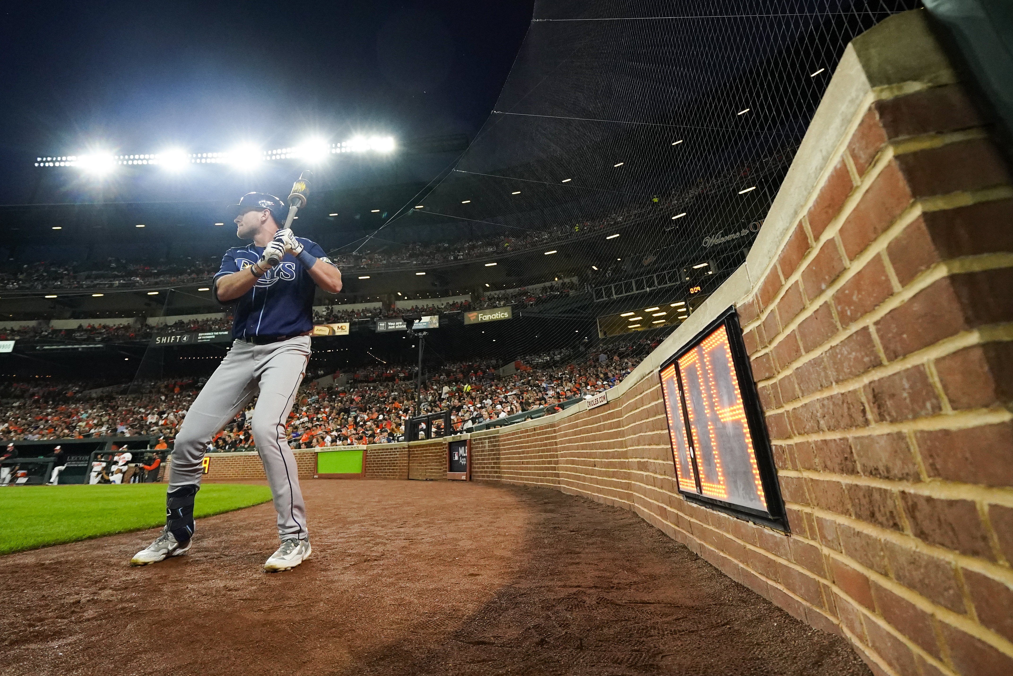 The pitch clock is seen as Tampa Bay Rays' Luke Raley stands near the on deck circle in the second inning of a baseball game against the Baltimore Orioles, Thursday, Sept. 14, 2023, in Baltimore.