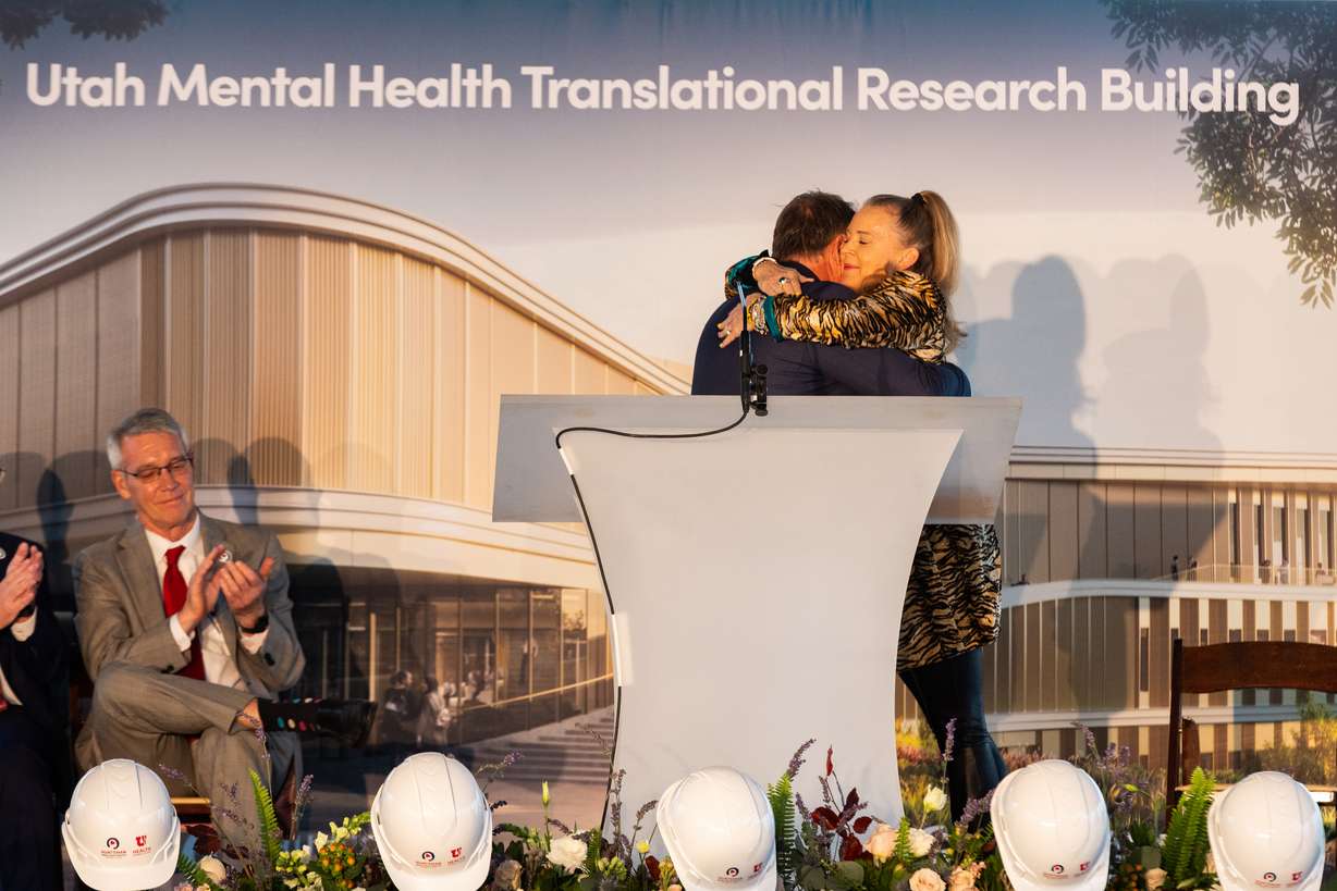 University of Utah President Taylor Randall hugs Christena Huntsman Durham, executive vice president of the Huntsman Foundation, during the groundbreaking ceremony for the Utah Mental Health Translational Research Building outside the Huntsman Mental Health Institute in Salt Lake City on Monday.