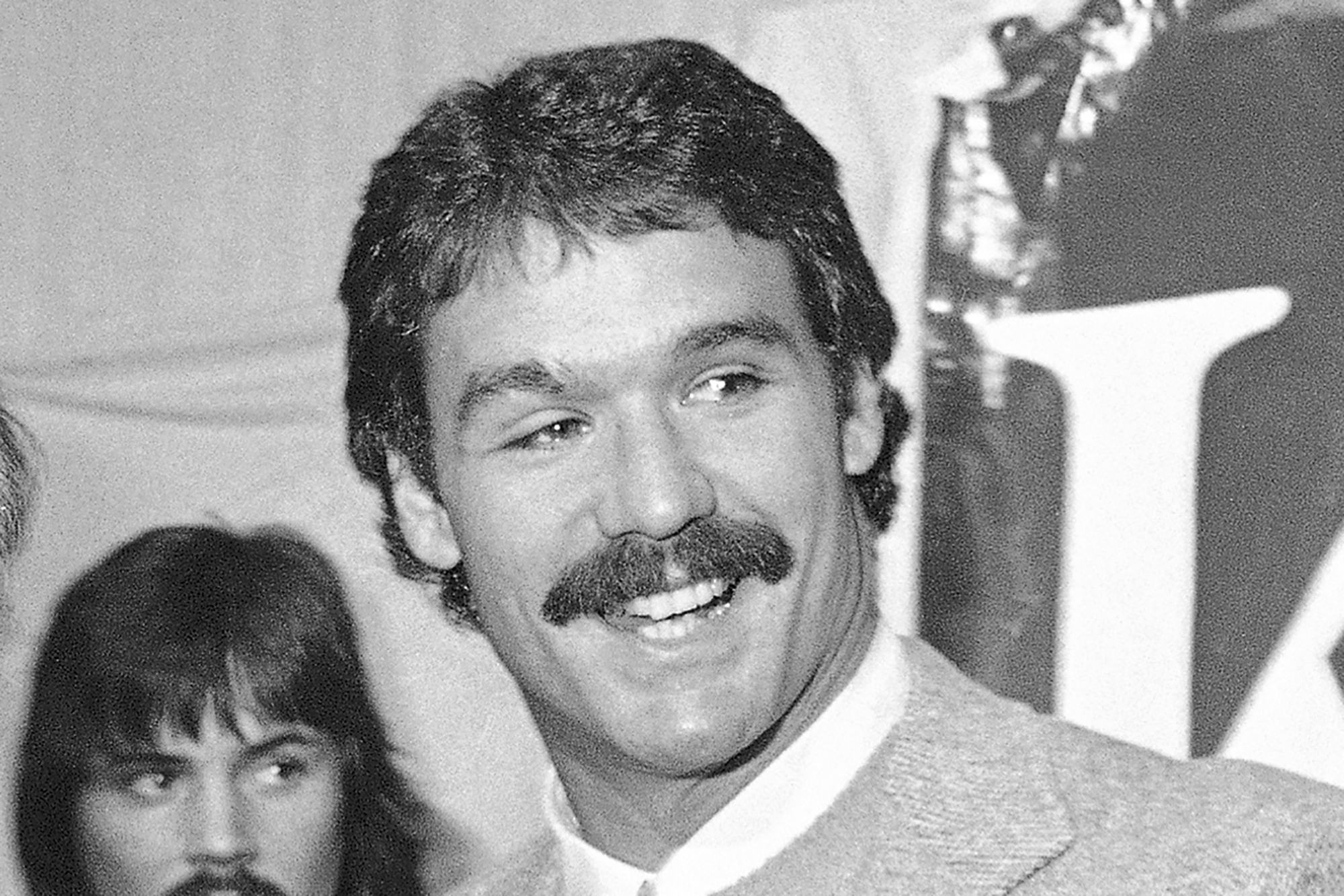 FILE - New England Patriots NFL football player Russ Francis smiles during a press conference Sunday, Feb. 11, 1980, at Boston Garden. Former NFL tight end Russ Francis, a three-time Pro Bowl selection with the New England Patriots who won a Super Bowl with the 1984 San Francisco 49ers, was killed along with another aviation enthusiast when the single-engine plane the two men were in crashed shortly after takeoff from an airport in upstate New York, authorities said Monday, Oct. 2, 2023. Francis was president of Lake Placid Airways, which runs charter and scenic flights.