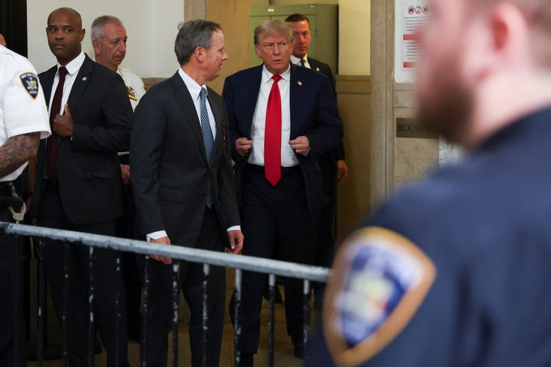 Former President Donald Trump arrives at a Manhattan courthouse, where he attends the trial of himself, his adult sons, the Trump Organization and others in a civil fraud case brought by state Attorney General Letitia James, in New York City, Tuesday.