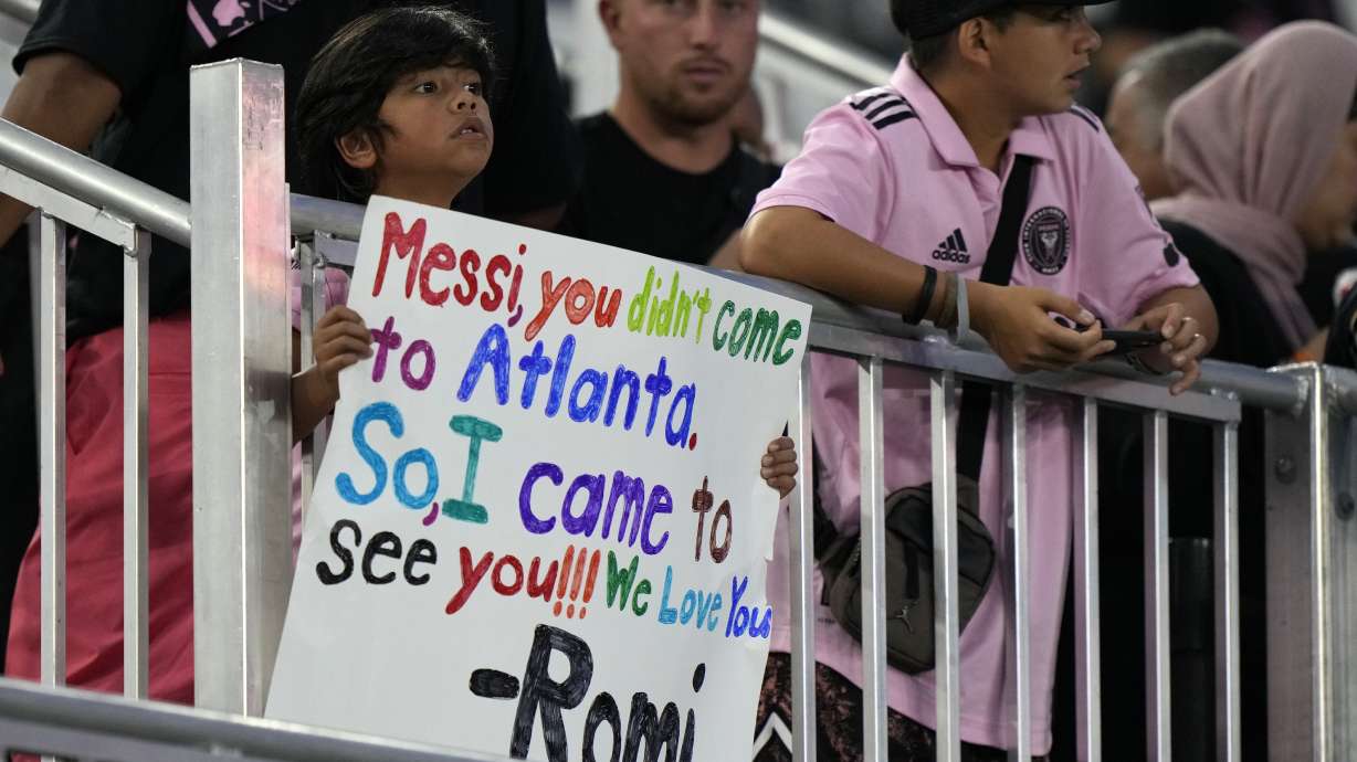 A young fan holds up a sign for Inter Miami forward Lionel Messi before the start of an MLS soccer match between Inter Miami and Toronto FC, Wednesday, Sept. 20, 2023, in Fort Lauderdale, Fla. While Messi's immediate impact is off-the-charts, it remains to be seen whether fans will be wooed to the league as a whole.