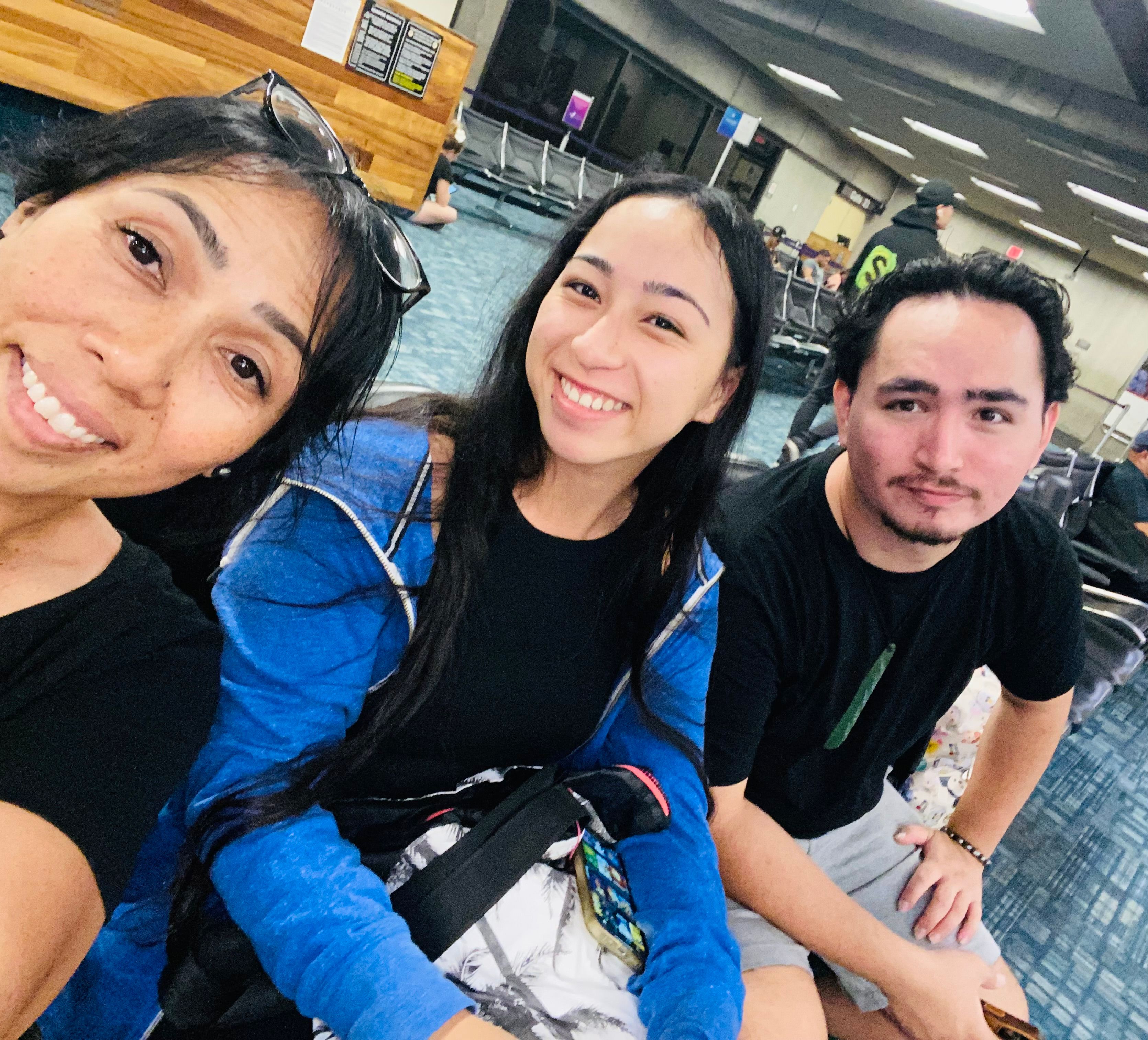 Hailey Chang sits with family members at the Kahului airport in Maui in this undated photo.