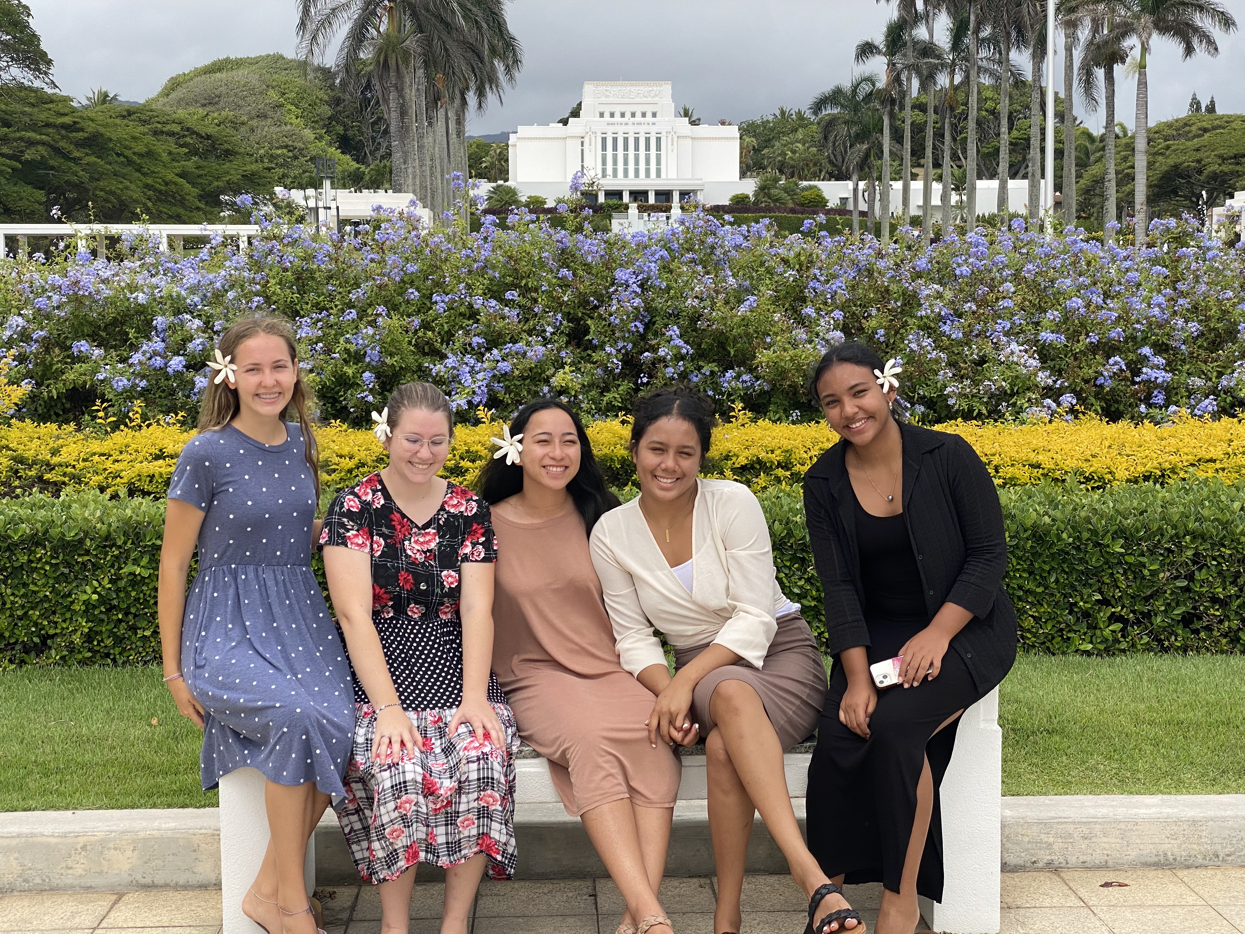 Hailey Chang, middle, and other young women sit at the Laie Hawaii Temple in this undated photo.