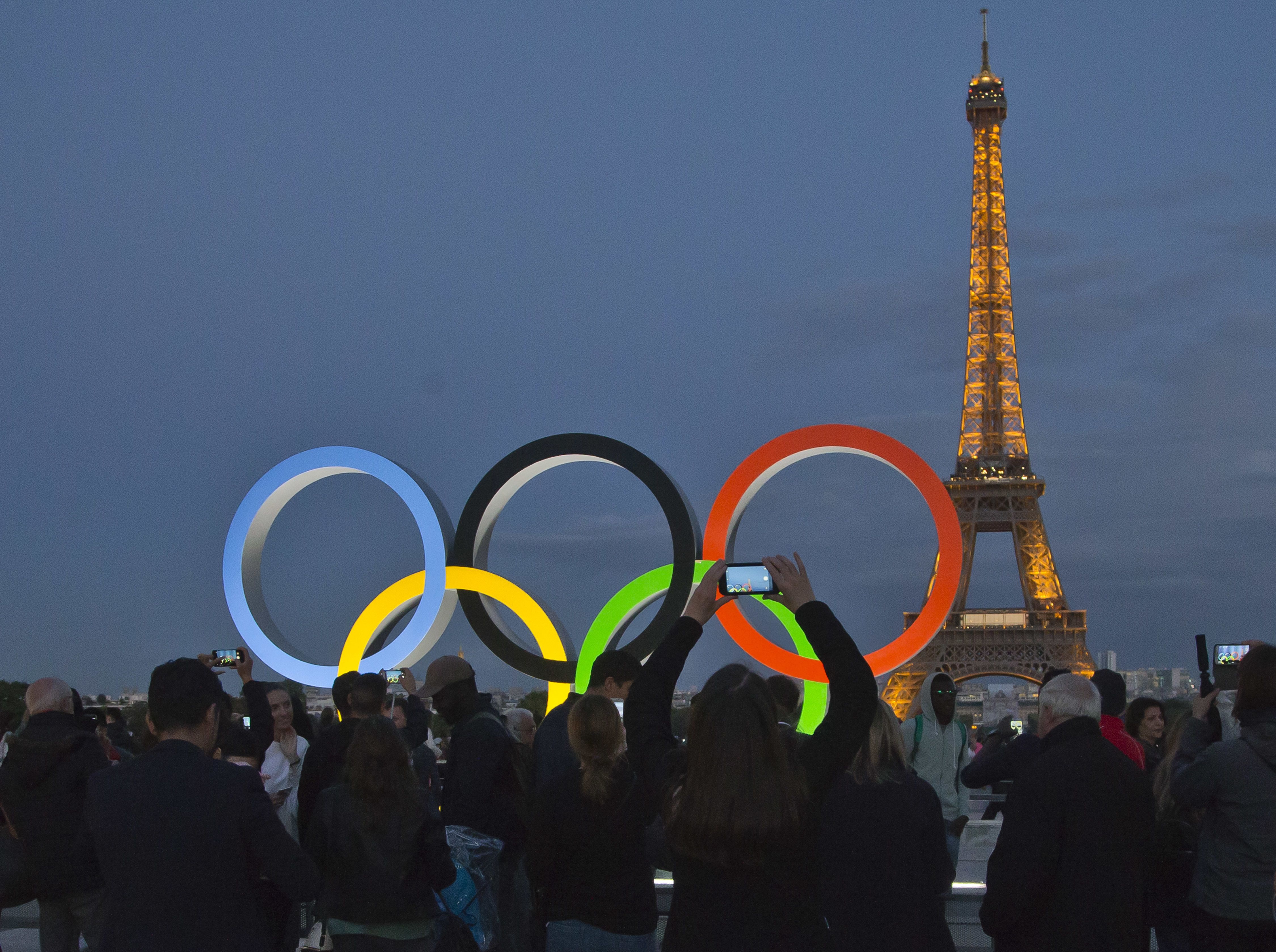 The Olympic rings are set up on Trocadero plaza that overlooks the Eiffel Tower in Paris, Sept. 14, 2017.