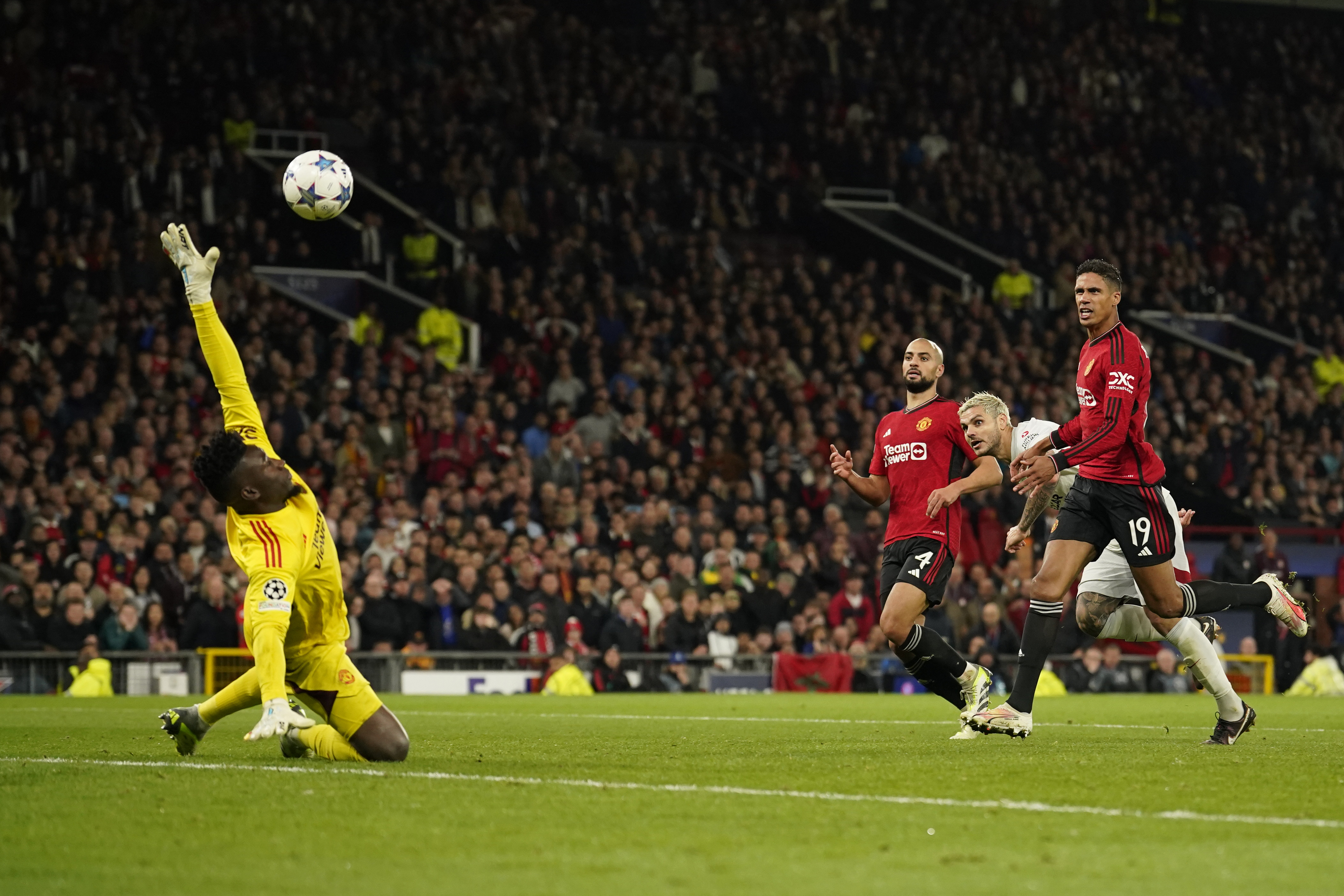 Galatasaray's Mauro Icardi, second from right, scores his side's third goal during the Champions League group A soccer match between Manchester United and Galatasaray at the Old Trafford stadium in Manchester, England, Tuesday, Oct. 3, 2023.