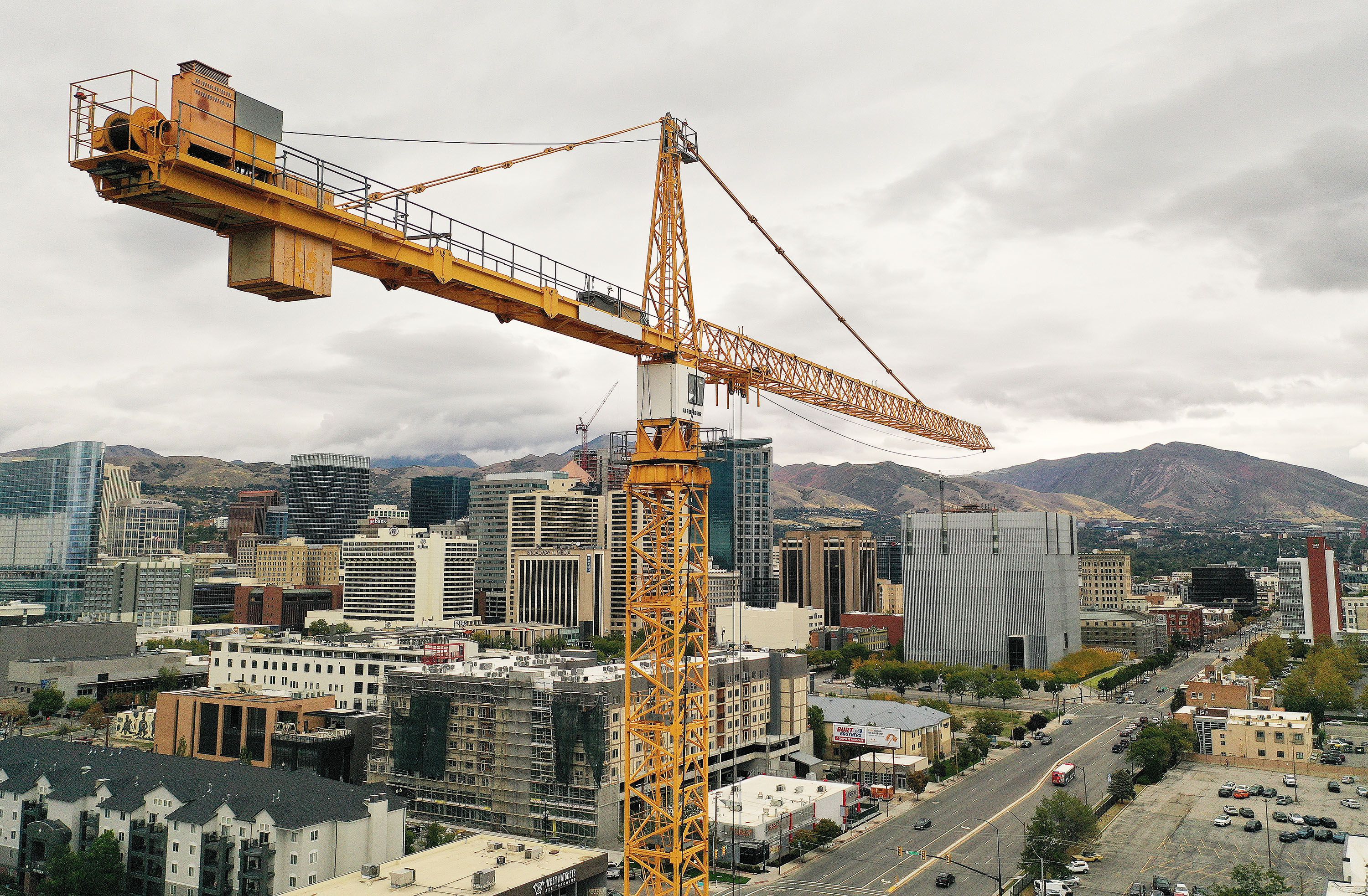 Building construction continues with a crane in downtown Salt Lake City on Tuesday.