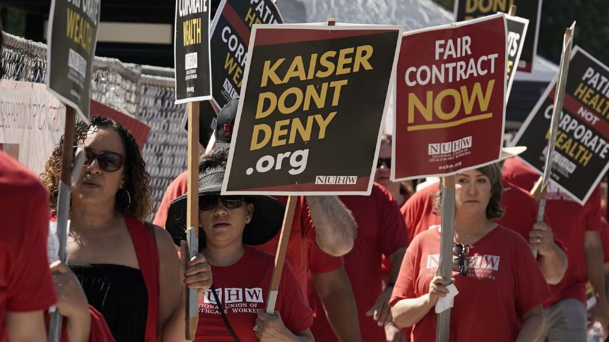 Kaiser Permanente mental health workers and supporters march outside a Kaiser facility in Sacramento, Calif., Aug. 15, 2022. Roughly 75,000 health care workers at the Kaiser Permanente hospital system on a three-day strike.
