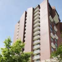 Man threw furniture from 14th floor of Little America, tried to grab officer's gun, charges say