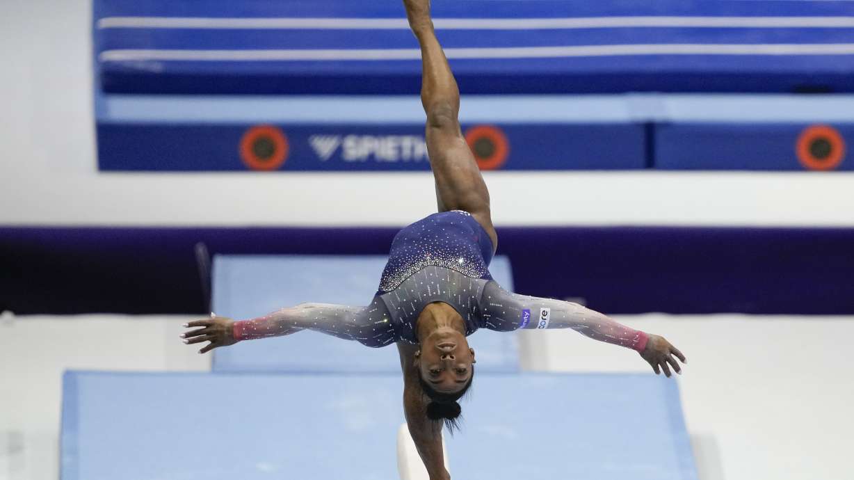 United States' Simone Biles competes on the beam during the women's team final at the Artistic Gymnastics World Championships in Antwerp, Belgium, Wednesday, Oct. 4, 2023.