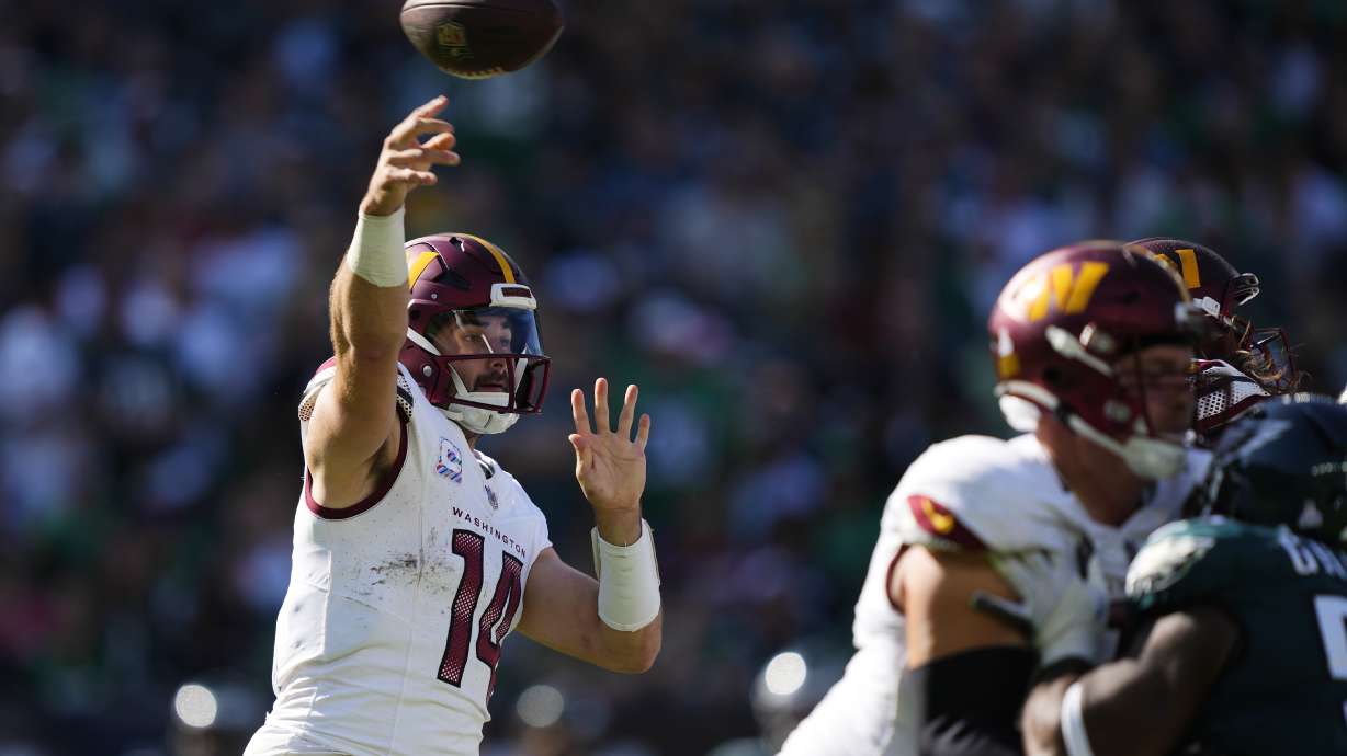 Washington Commanders quarterback Sam Howell (14) throws during the second half of an NFL football game against the Philadelphia Eagles on Sunday, Oct. 1, 2023, in Philadelphia.