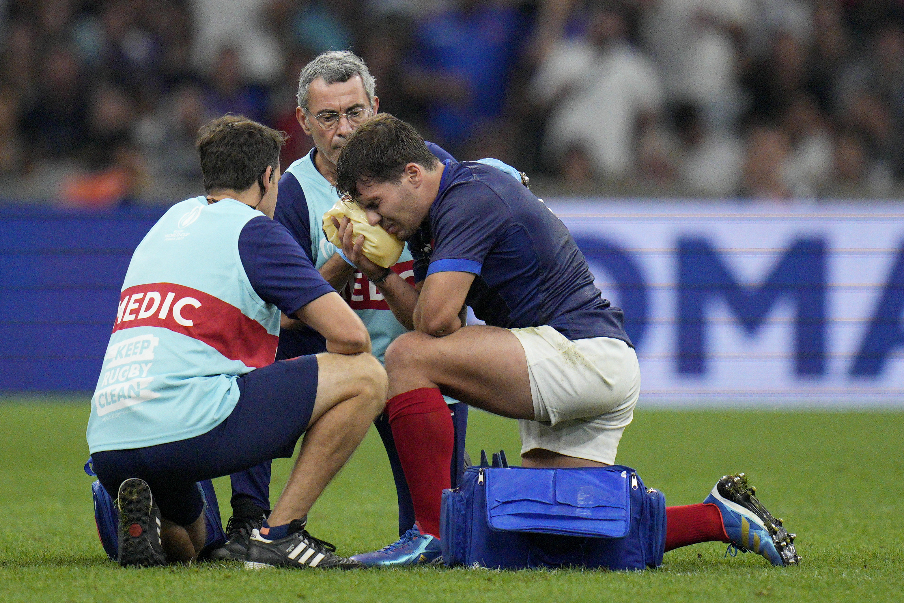 France's Antoine Dupont receives treatment after taking a knock to the head during the Rugby World Cup Pool A match between France and Namibia at the Stade de Marseille in Marseille, France, Thursday, Sept. 21, 2023. 