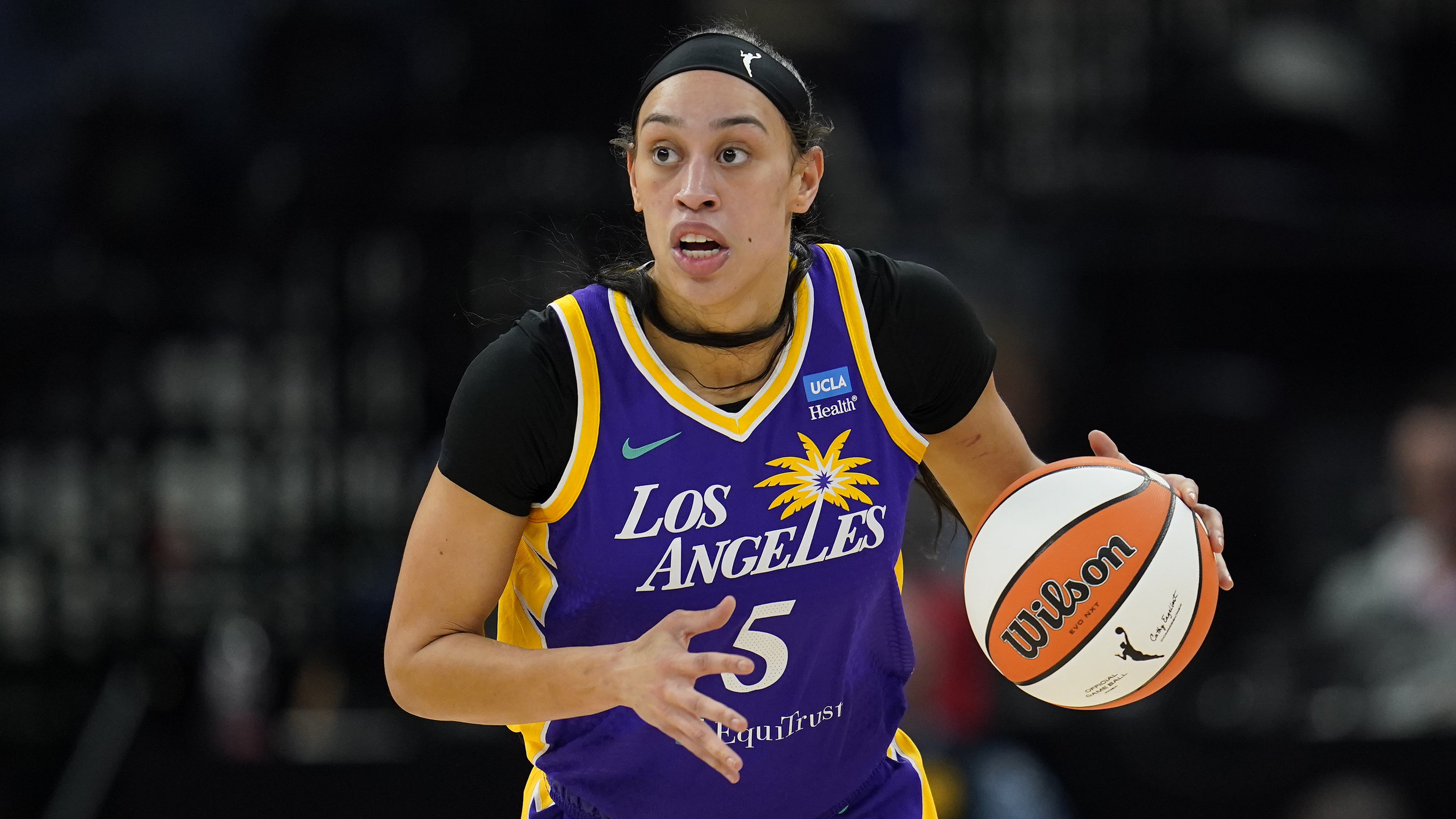 FILE - Los Angeles Sparks forward Dearica Hamby dribbles down the court during the first half of a WNBA basketball against the Minnesota Lynx, game Sunday, June 11, 2023, in Minneapolis. Dearica Hamby filed a gender discrimination complaint last week against the WNBA and the Las Vegas Aces, saying her former team and its coach, Becky Hammon, retaliated against her after she informed them she was pregnant. Hamby filed the complaint with the Nevada Equal Rights Commission and the Equal Employment Opportunity Commission, according to a copy of the complaint obtained by The Associated Press on Thursday, Oct. 5, 2023. 