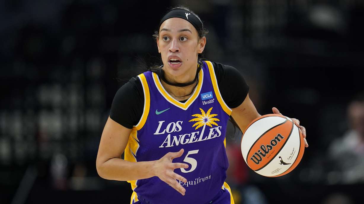 FILE - Los Angeles Sparks forward Dearica Hamby dribbles down the court during the first half of a WNBA basketball against the Minnesota Lynx, game Sunday, June 11, 2023, in Minneapolis. Dearica Hamby filed a gender discrimination complaint last week against the WNBA and the Las Vegas Aces, saying her former team and its coach, Becky Hammon, retaliated against her after she informed them she was pregnant. Hamby filed the complaint with the Nevada Equal Rights Commission and the Equal Employment Opportunity Commission, according to a copy of the complaint obtained by The Associated Press on Thursday, Oct. 5, 2023.