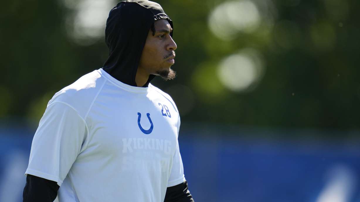 FILE - Indianapolis Colts running back Jonathan Taylor watches drills during practice at the NFL team's football training camp in Westfield, Ind., July 31, 2023. The Colts will activate the All-Pro running back this week and he could play Sunday, Oct. 8, against Tennessee.