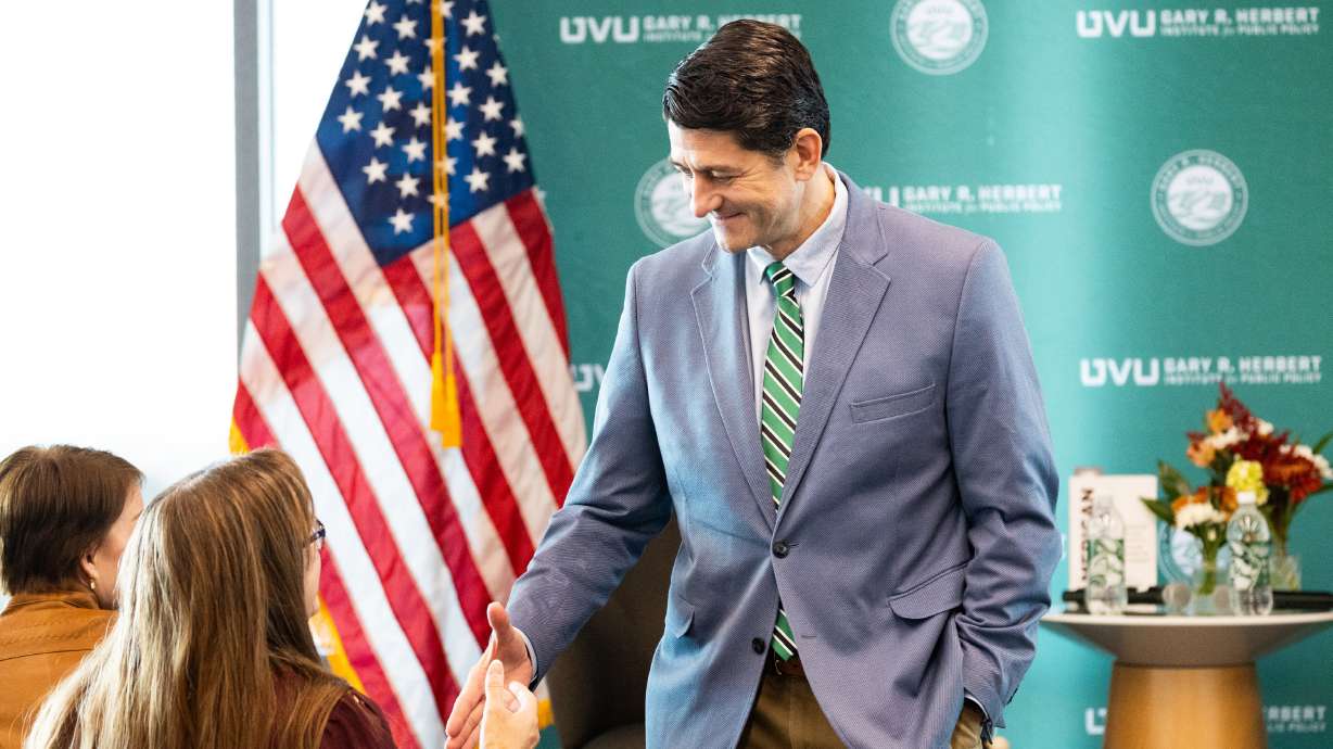 Paul Ryan, a former U.S. House speaker and the 2012 Republican vice presidential candidate, shakes hands with Maryann Jones after a fireside chat hosted by the Gary R. Herbert Institute for Public Policy at Utah Valley University in Orem on Thursday.