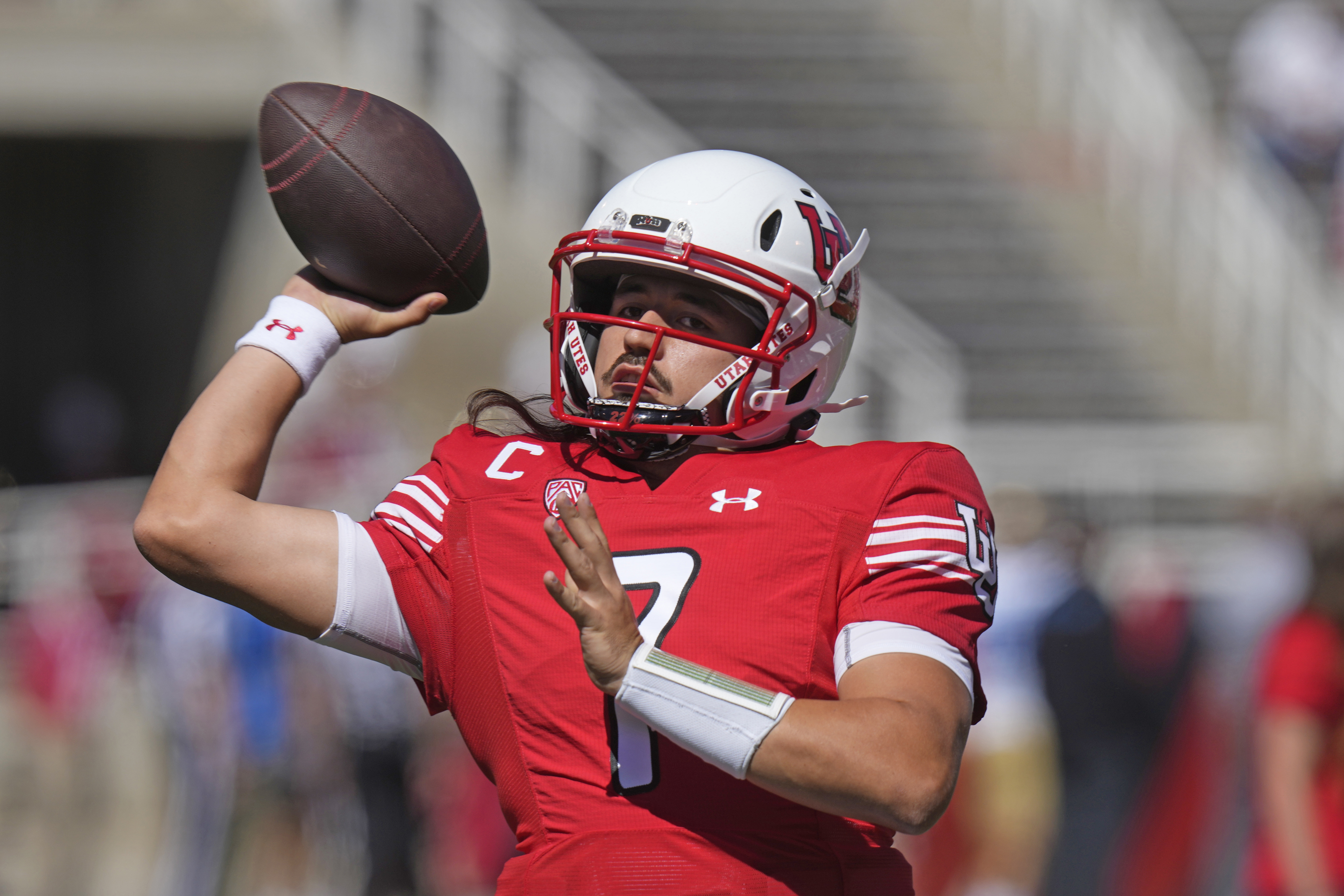 Utah quarterback Cameron Rising (7) warms up before an NCAA college football game against UCLA, Saturday, Sept. 23, 2023, in Salt Lake City.