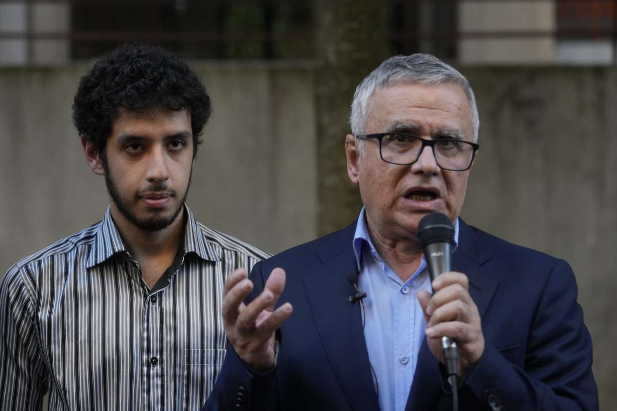 Narges Mohammadi's husband Taghi Rahmani and their son Ali attend a press conference, Friday in Paris. Imprisoned Iranian activist Narges Mohammadi won the Nobel Peace Prize on Friday in recognition of her tireless campaigning for women's rights and democracy and against the death penalty.