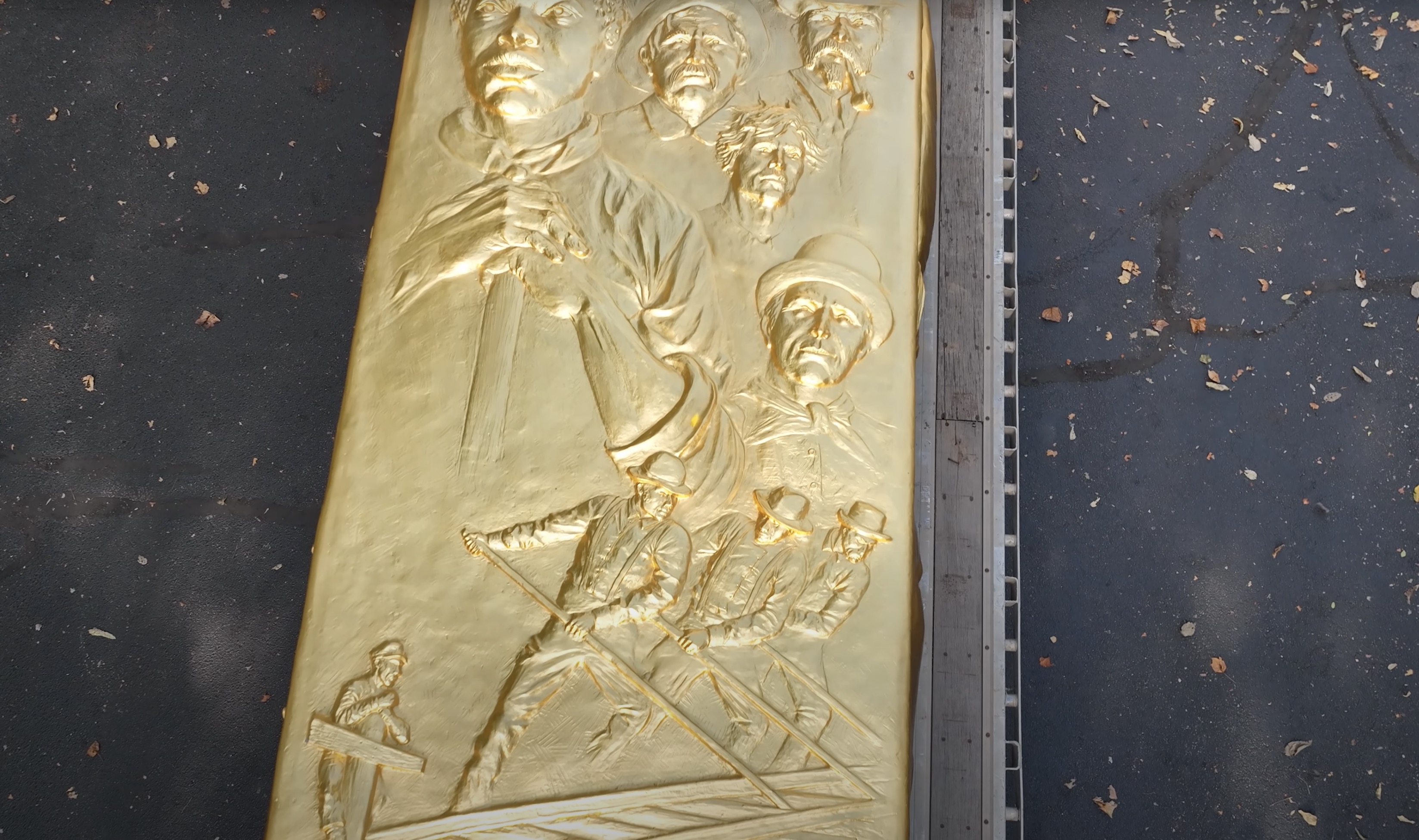 Some of the carvings included in the Golden Spike Monument unveiled in Lexington, Kentucky, on Thursday. The monument will be installed at Golden Spike National Historical Park in Utah next year.