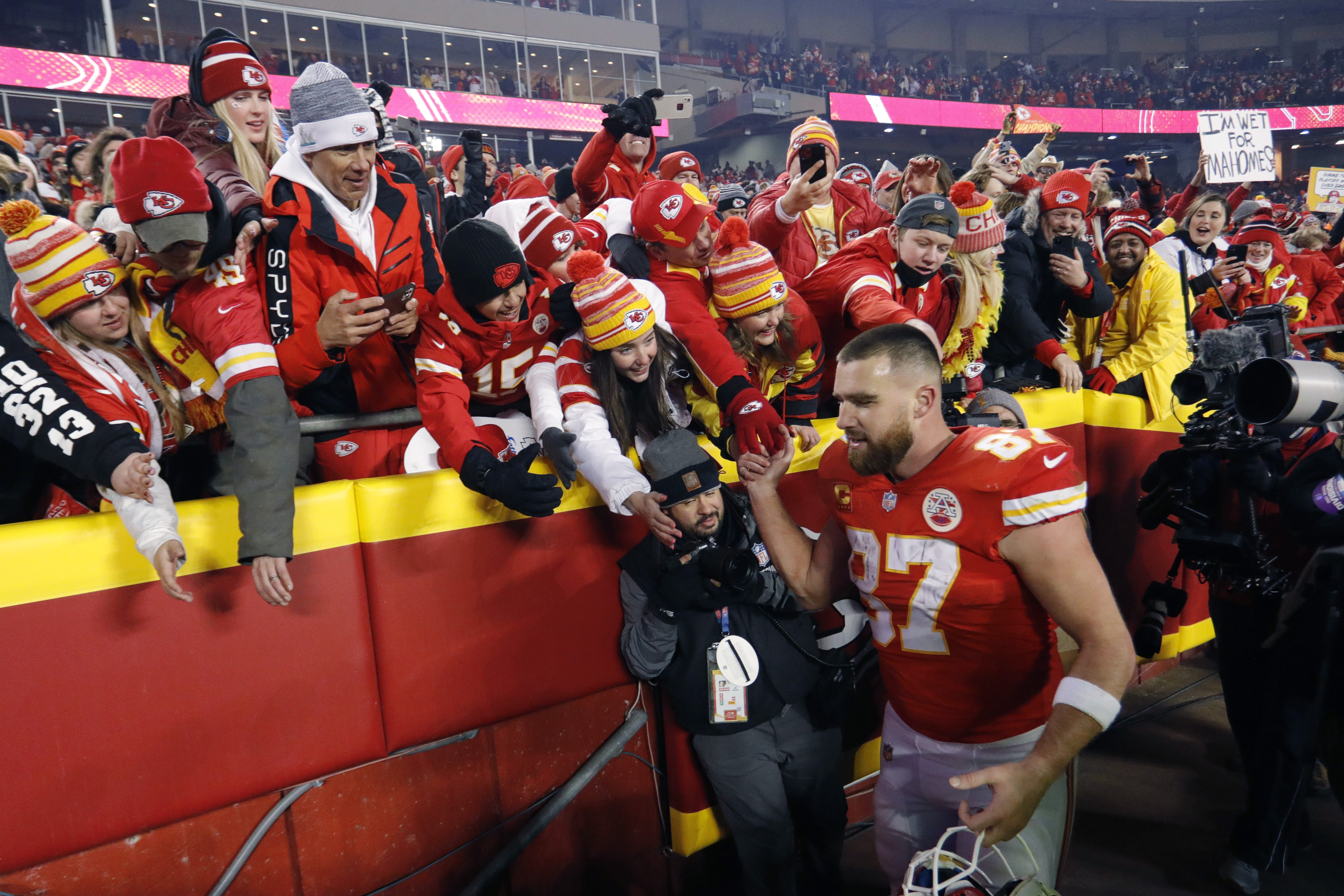 FILE - Kansas City Chiefs tight end Travis Kelce (87) celebrates with fans as he walks off the field after an NFL divisional round playoff football game against the Buffalo Bills, Sunday, Jan. 23, 2022, in Kansas City, Mo. Eager as the National Football League has been to cater to the recent public fixation with Taylor Swift and Travis Kelce, it’s certainly not taking any credit for creating the "situationship" between the pop superstar and the Kansas City Chiefs tight end.