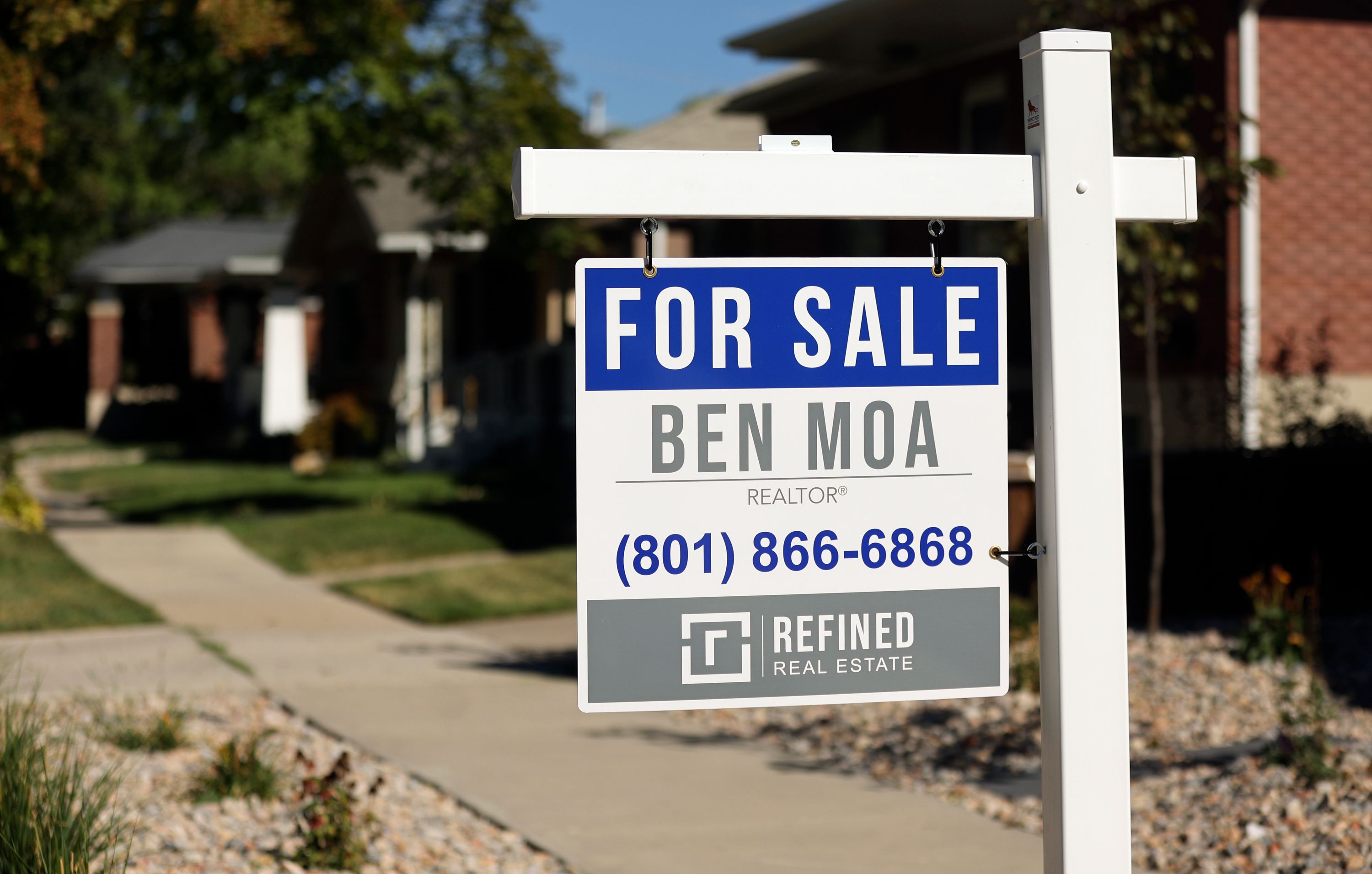 A for sale sign is pictured in Salt Lake City on Aug. 28. After six months of growth, home prices in most of Utah's Wasatch Front counties have ticked down slightly, marking a turning point.