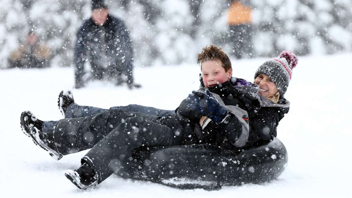 Tubers enjoy the snow in Big Cottonwood Canyon on Dec. 30, 2022. The Spanish Fork City Council has approved an agreement to create a man-made tubing hill on the driving range at The Oaks at Spanish Fork golf course.