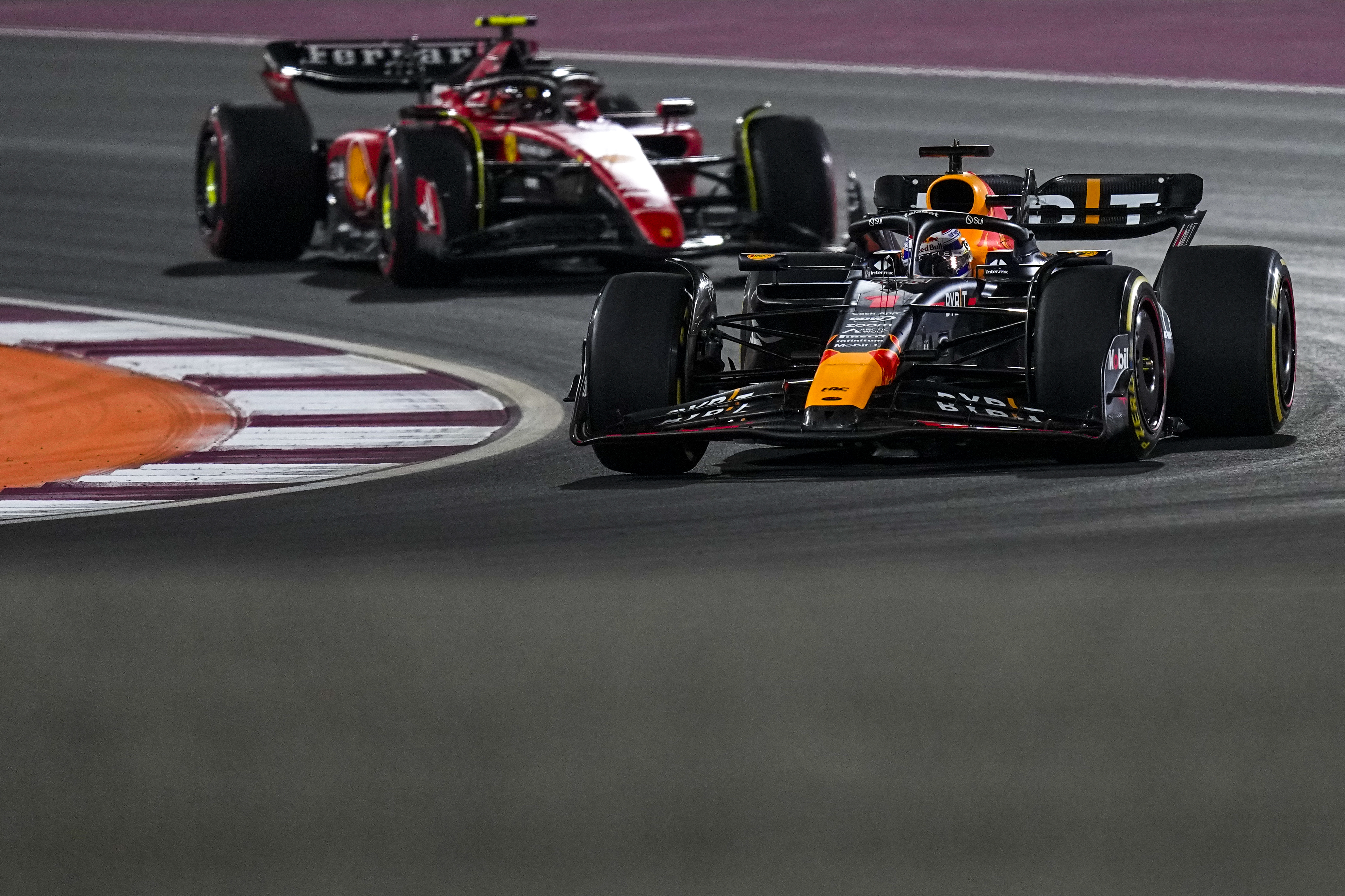 Red Bull driver Max Verstappen of the Netherlands steers his car followed by Ferrari driver Carlos Sainz of Spain during the sprint race ahead of the Qatar Formula One Grand Prix at the Lusail International Circuit, in Lusail, Qatar, Saturday, Oct. 7, 2023.