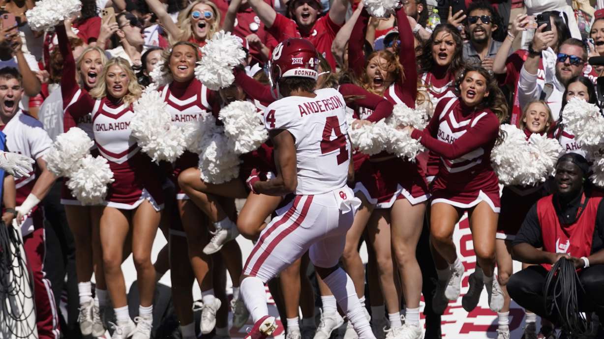 Oklahoma wide receiver Nic Anderson (4) scores the game winning touchdown late in the second half of an NCAA college football game against Texas at the Cotton Bowl in Dallas, Saturday, Oct. 7, 2023.
