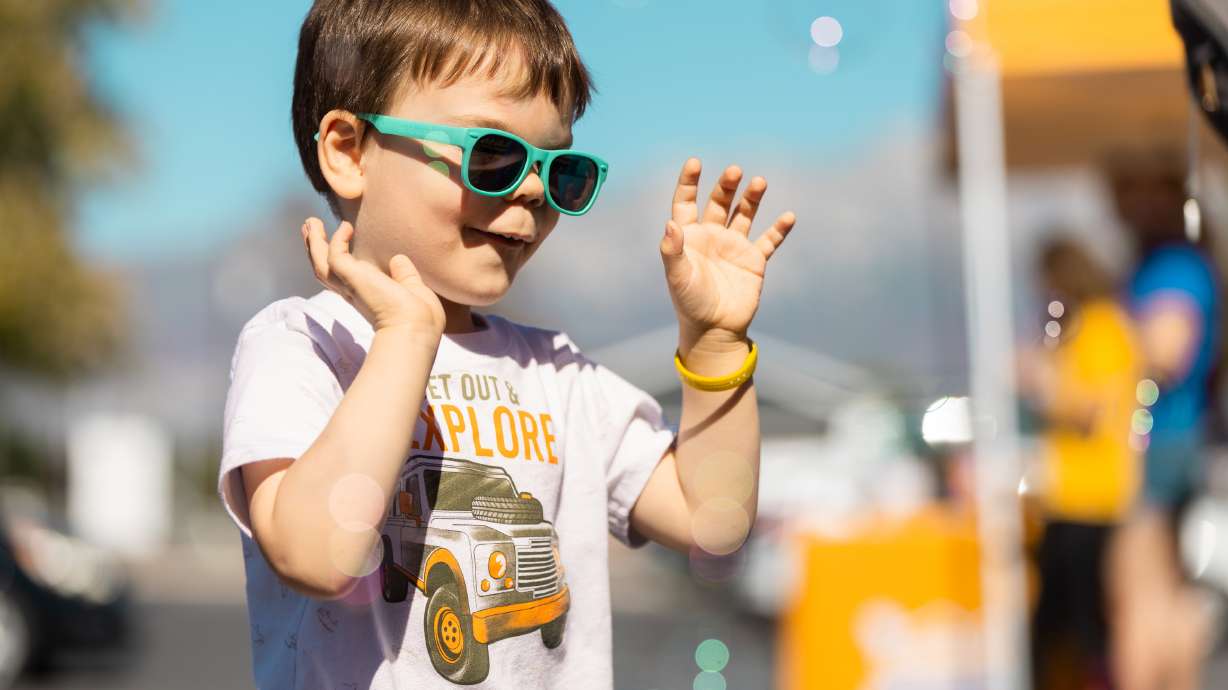 Carson Smith plays with bubbles at Success On The Spectrum’s Autism Play Day, a free event for American Fork families intended to create a safe and inclusive space for children with autism, at Success On The Spectrum in American Fork on Saturday.