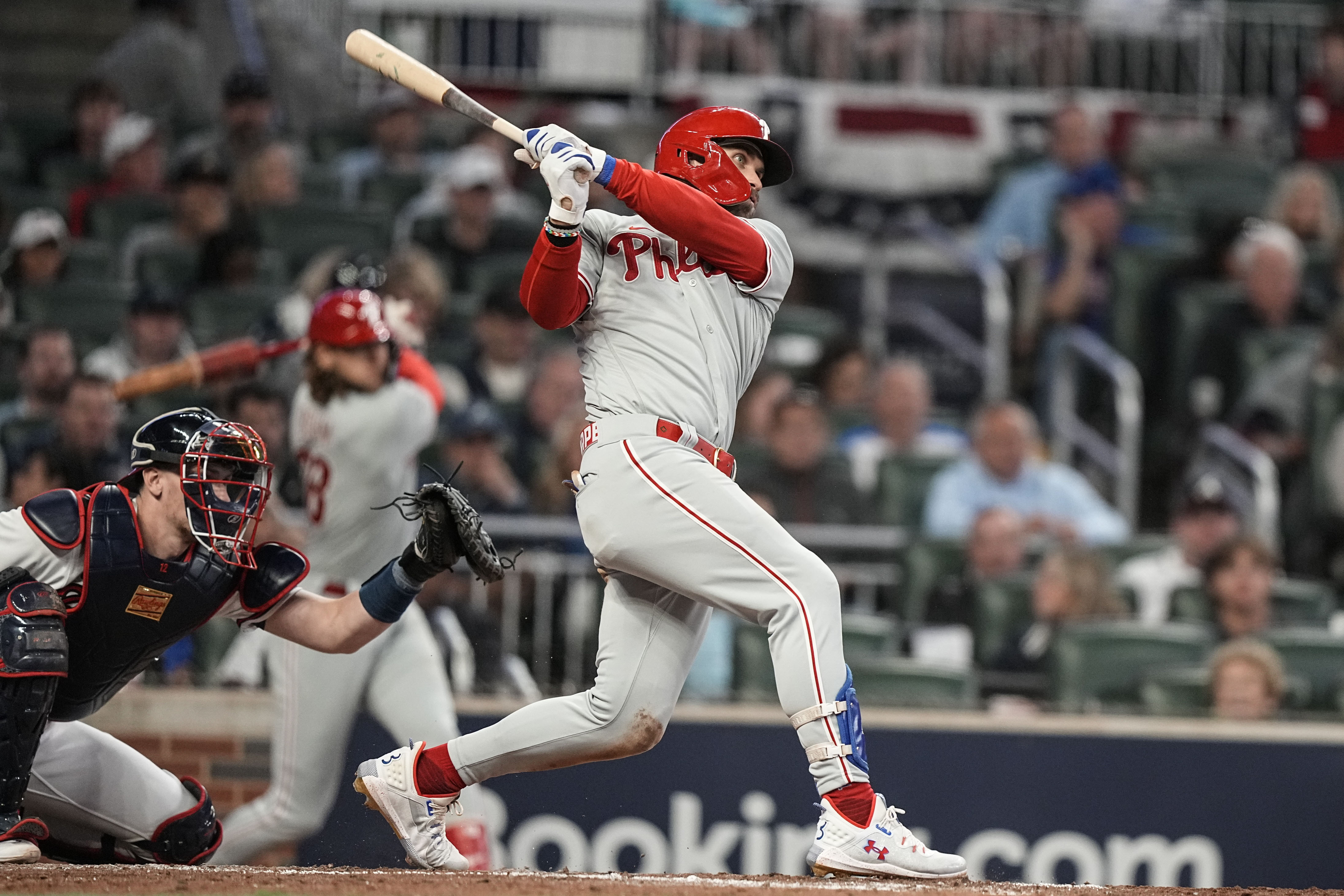 Philadelphia Phillies designated hitter Bryce Harper (3) hits a solo homer against the Atlanta Braves during the sixth inning of Game 1 of a baseball NL Division Series, Saturday, Oct. 7, 2023, in Atlanta.