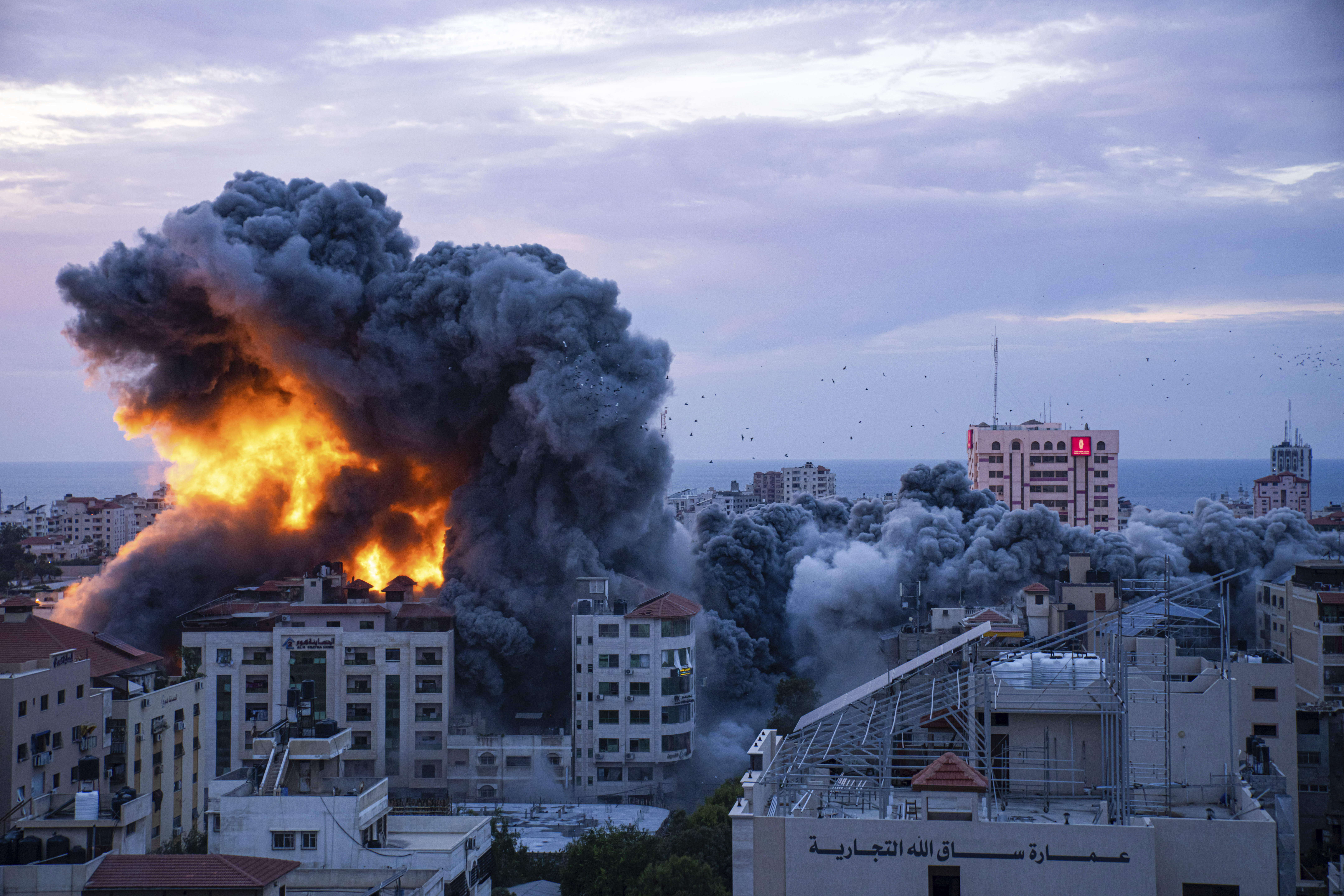 Fire and smoke rises following an Israeli airstrike, in Gaza City, Saturday. The militant Hamas rulers of the Gaza Strip carried out an unprecedented, multi-front attack on Israel at daybreak Saturday.