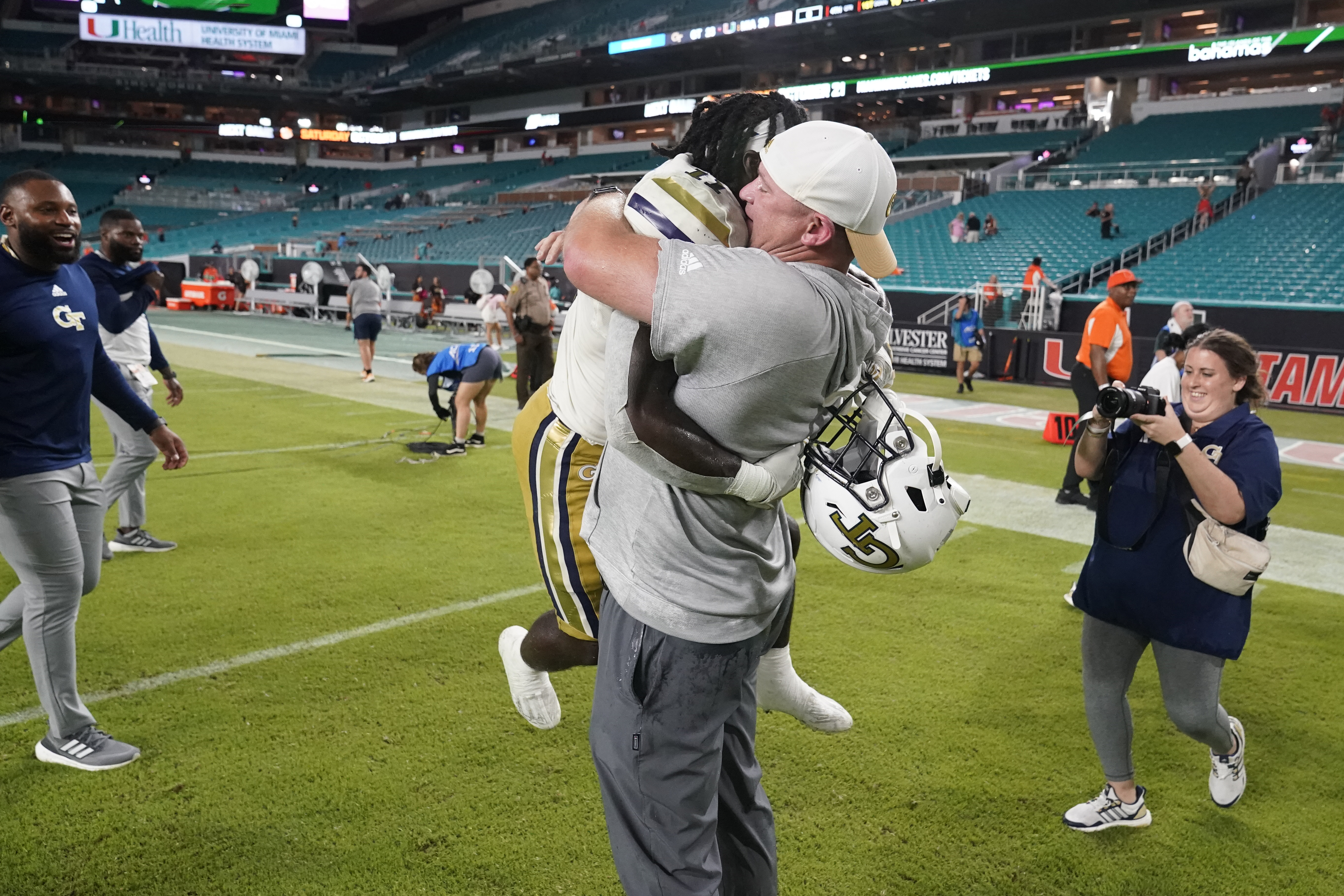 Georgia Tech head coach Brent Key picks up running back Jamal Haynes as they celebrate their 23-20 win over Miami in an NCAA college football game, Saturday, Oct. 7, 2023, in Miami Gardens, Fla.