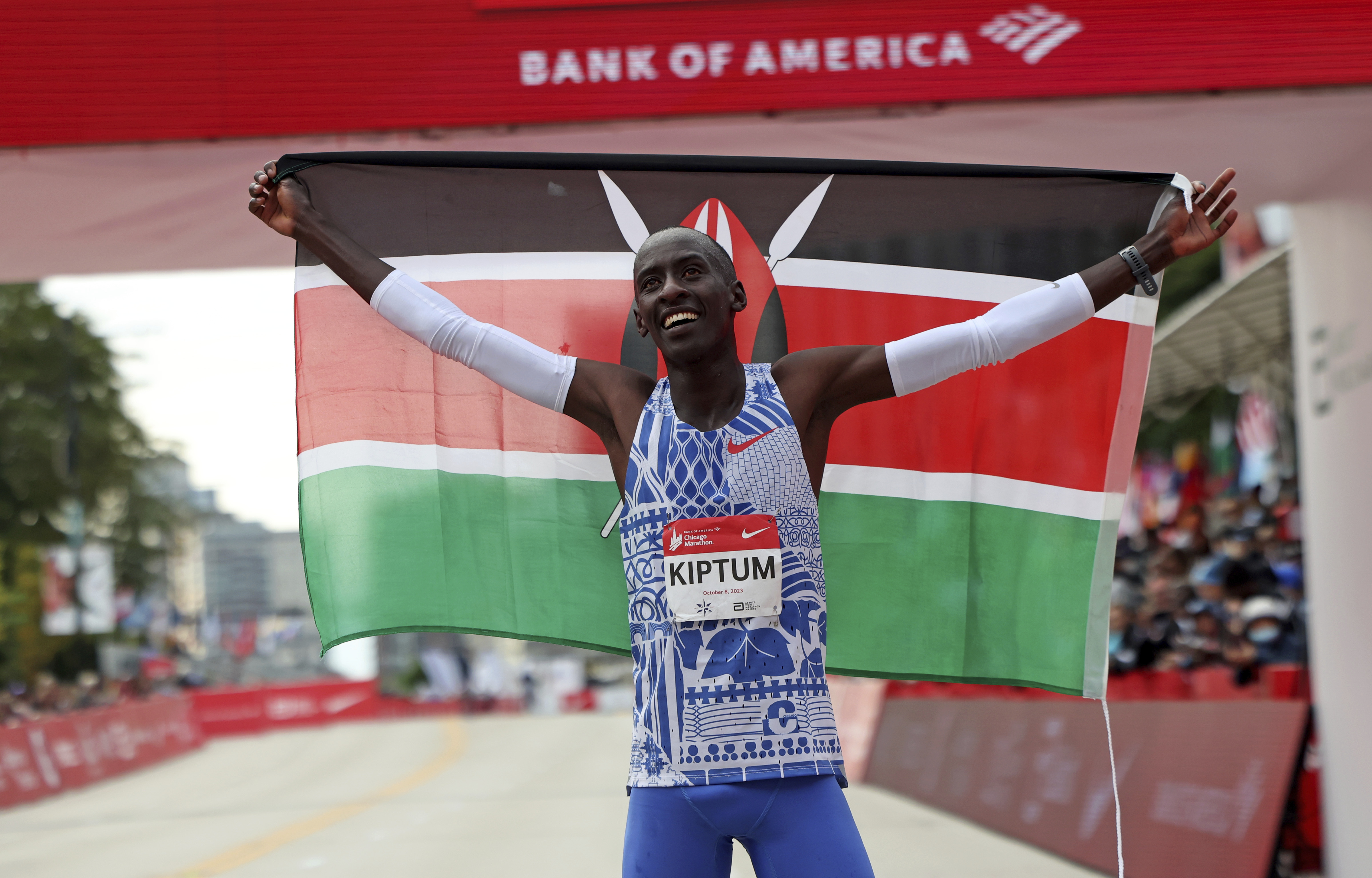 Kelvin Kiptum of Kenya celebrates his Chicago Marathon world record victory in Chicago's Grant Park on Sunday, Oct. 8, 2023.