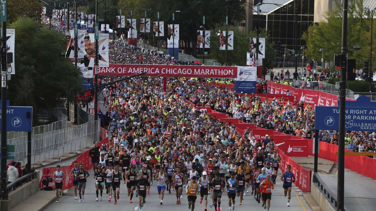 Thousands of runners head north on Columbus Avenue in Grant Park to start the Chicago Marathon on Oct. 8, 2023.