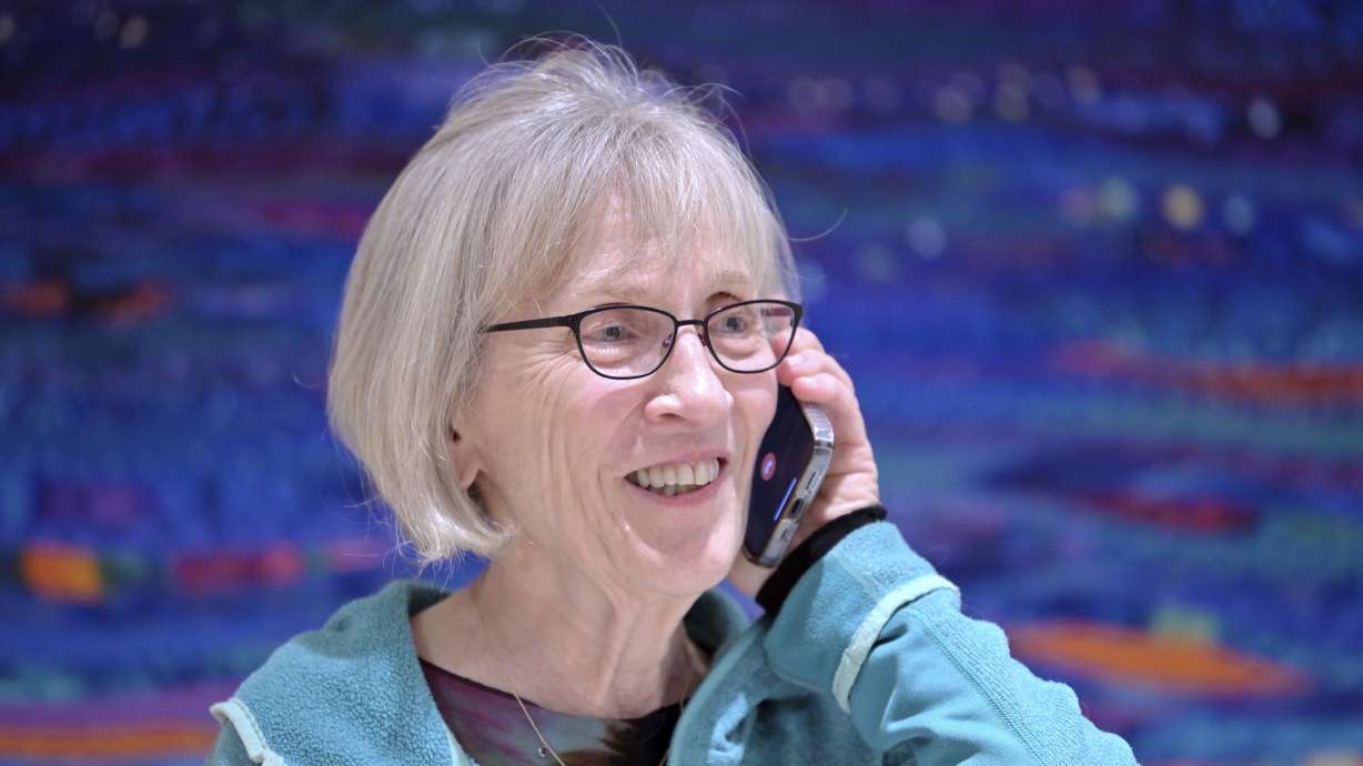 Claudia Goldin speaks to a reporter on the phone in her home in Cambridge, Mass., after learning that she received the Nobel Prize in Economics, Monday. The Nobel Prize in Economic Sciences has been awarded to Claudia Goldin for her work on the understanding of the gender gap in the labor market.