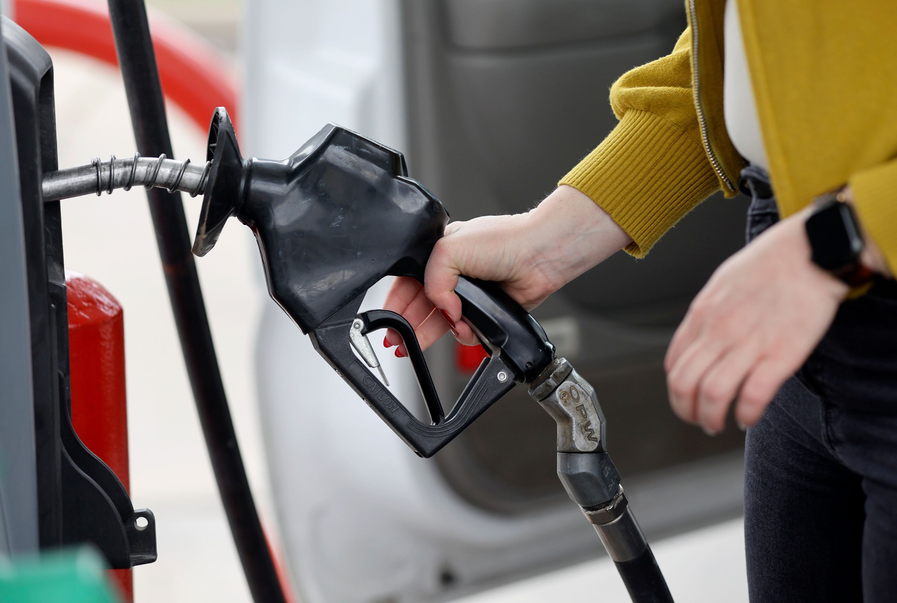 A woman gets gas at Shoppers Express in Salt Lake City on Sept. 13.