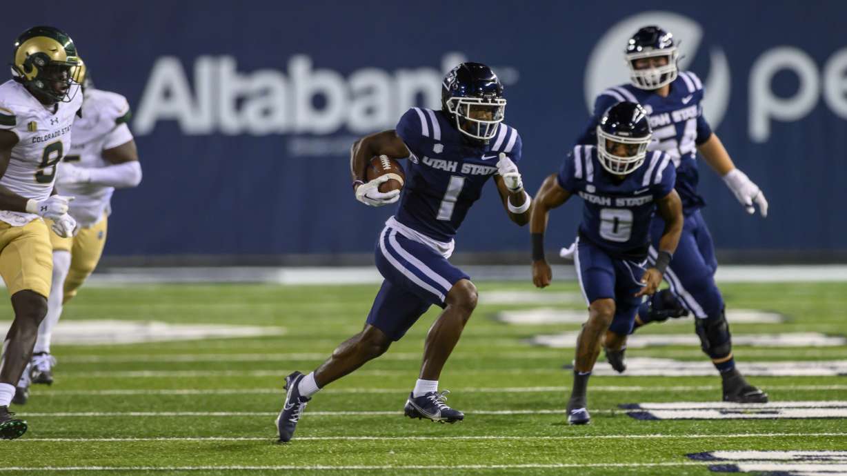 Utah State wide receiver Jalen Royals (1) runs the ball upfield after a catch during an NCAA football game on Saturday, Oct. 7, 2023 in Logan, Utah.