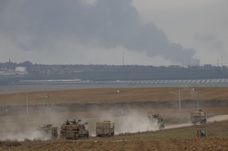Israeli army vehicles move near the Israeli Gaza border, southern Israel, Monday. The militant Hamas rulers of the Gaza Strip carried out an unprecedented, multi-front attack on Israel at daybreak Saturday.