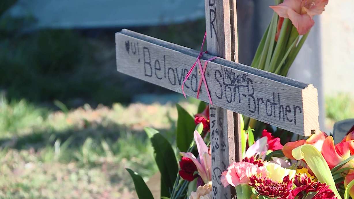 A sign left behind on Monday at the scene of the fatal accident on memorializes 22-year-old Ryker Reynolds who was killed on Sunday.