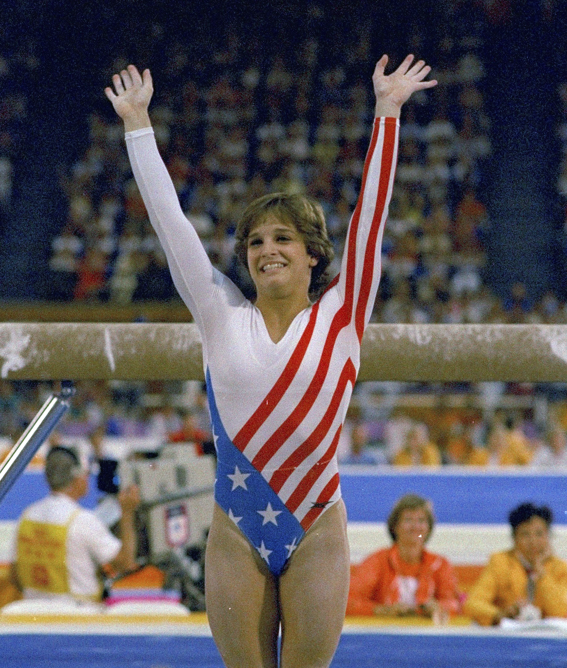 Mary Lou Retton reacts to applause after her performance at the Summer Olympics in Los Angeles on Aug. 3, 1984. Retton, 55, is in intensive care in a Texas hospital fighting a rare form of pneumonia, according to her daughter McKenna Kelley. 