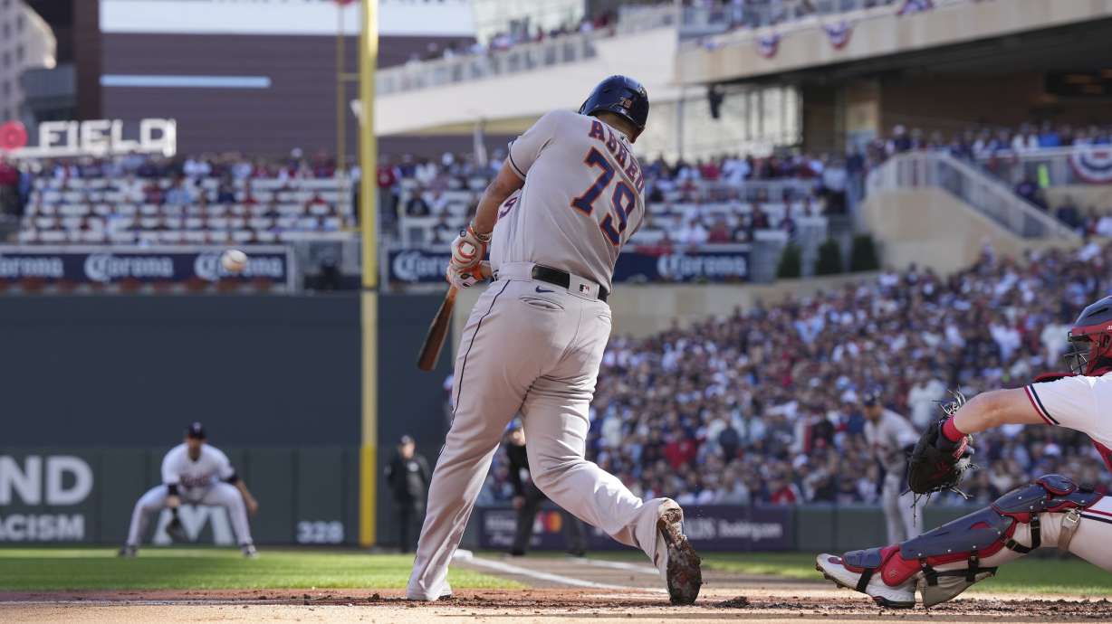 Houston Astros' Jose Abreu connects for a three-run home run during the first inning of Game 3 of an American League Division Series baseball game against the Minnesota Twins, Tuesday, Oct. 10, 2023, in Minneapolis.
