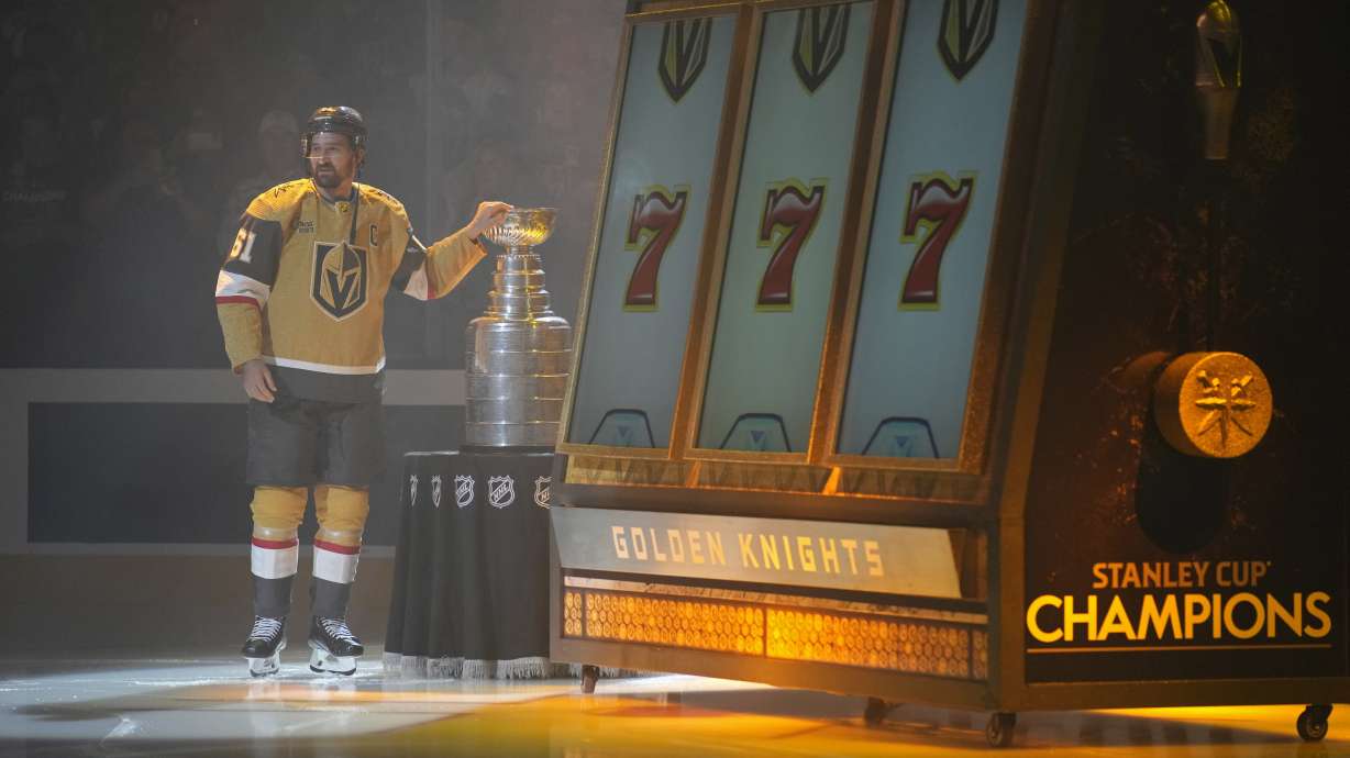 Vegas Golden Knights right wing Mark Stone (61) stands by the Stanley Cup during a ceremony before an NHL hockey game against the Seattle Kraken, Tuesday, Oct. 10, 2023, in Las Vegas.