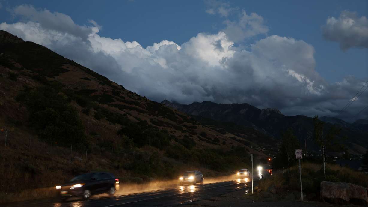 Cars kick up water from rain on Wasatch Boulevard on Sept. 21, 2022. People waking up across the Wasatch Front Wednesday morning were greeted by cold temperatures, cloudy skies and rain.